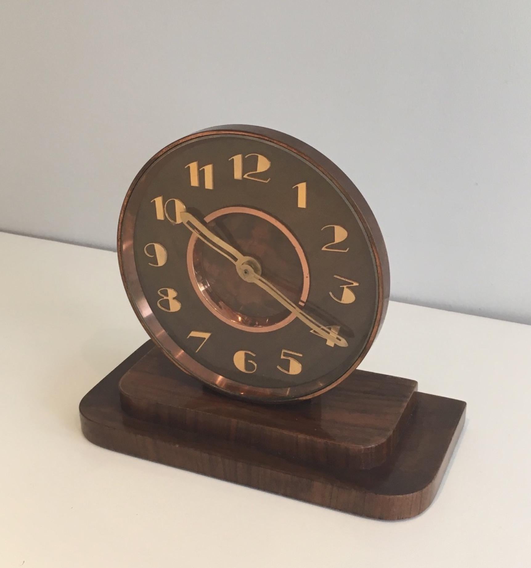 This table clock is made of wood, brass and glass. This is a French work, Art Deco period. Circa 1930.