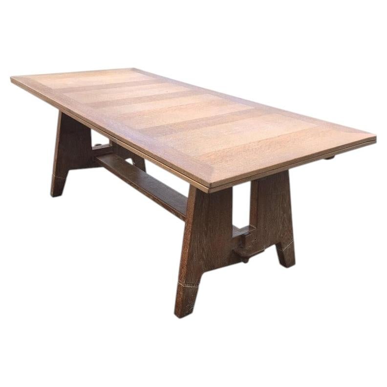 Art Deco table in oak in the style of Charles Dudouyt, circa 1940.