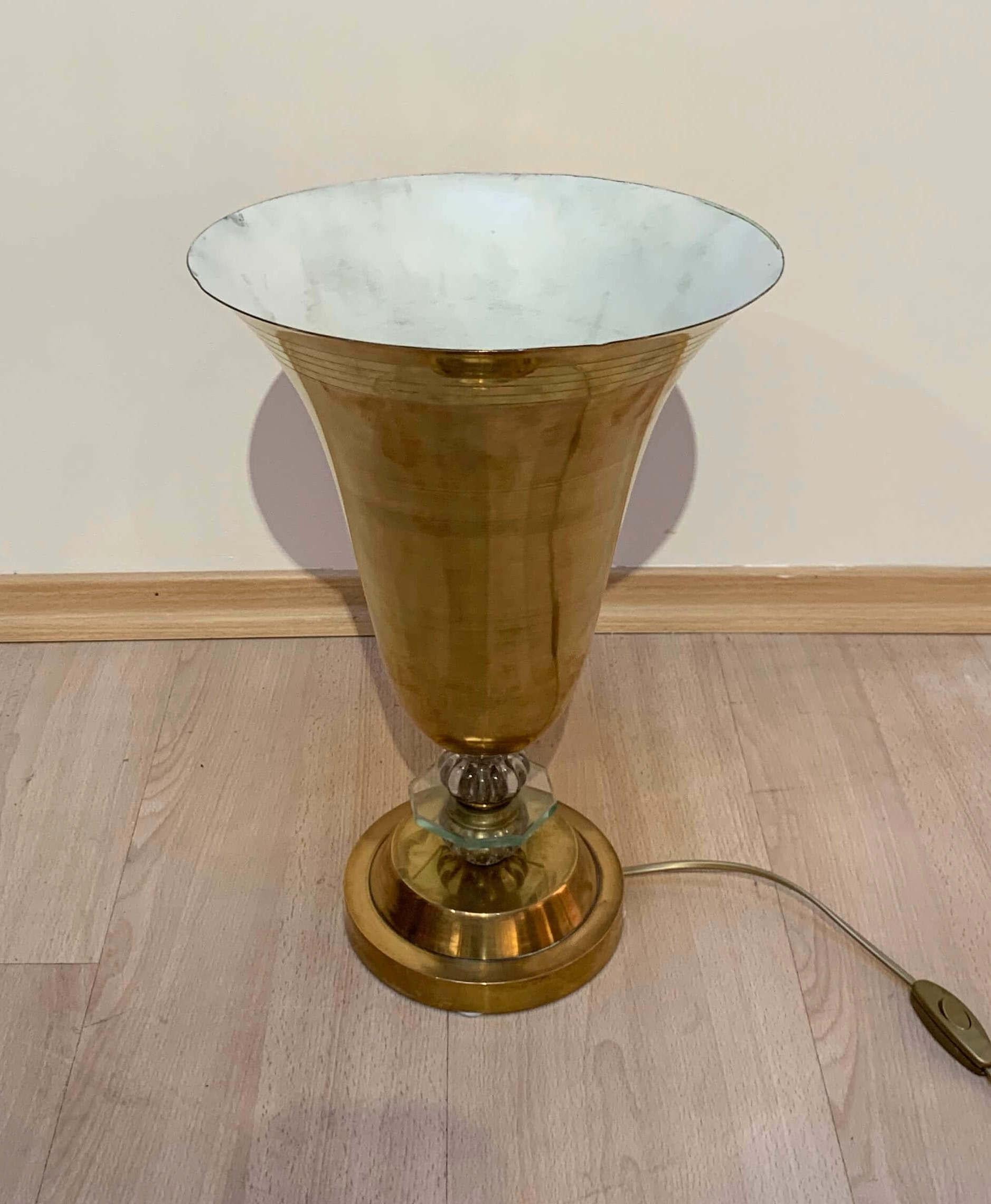 Art Deco table lamp, brass and glass from Paris, France, circa 1930
Polished brass body in elegant conical shape with engraved horizontal rings. Cut glass ring decorative balls at the leg. 1 light bulb in the socket.