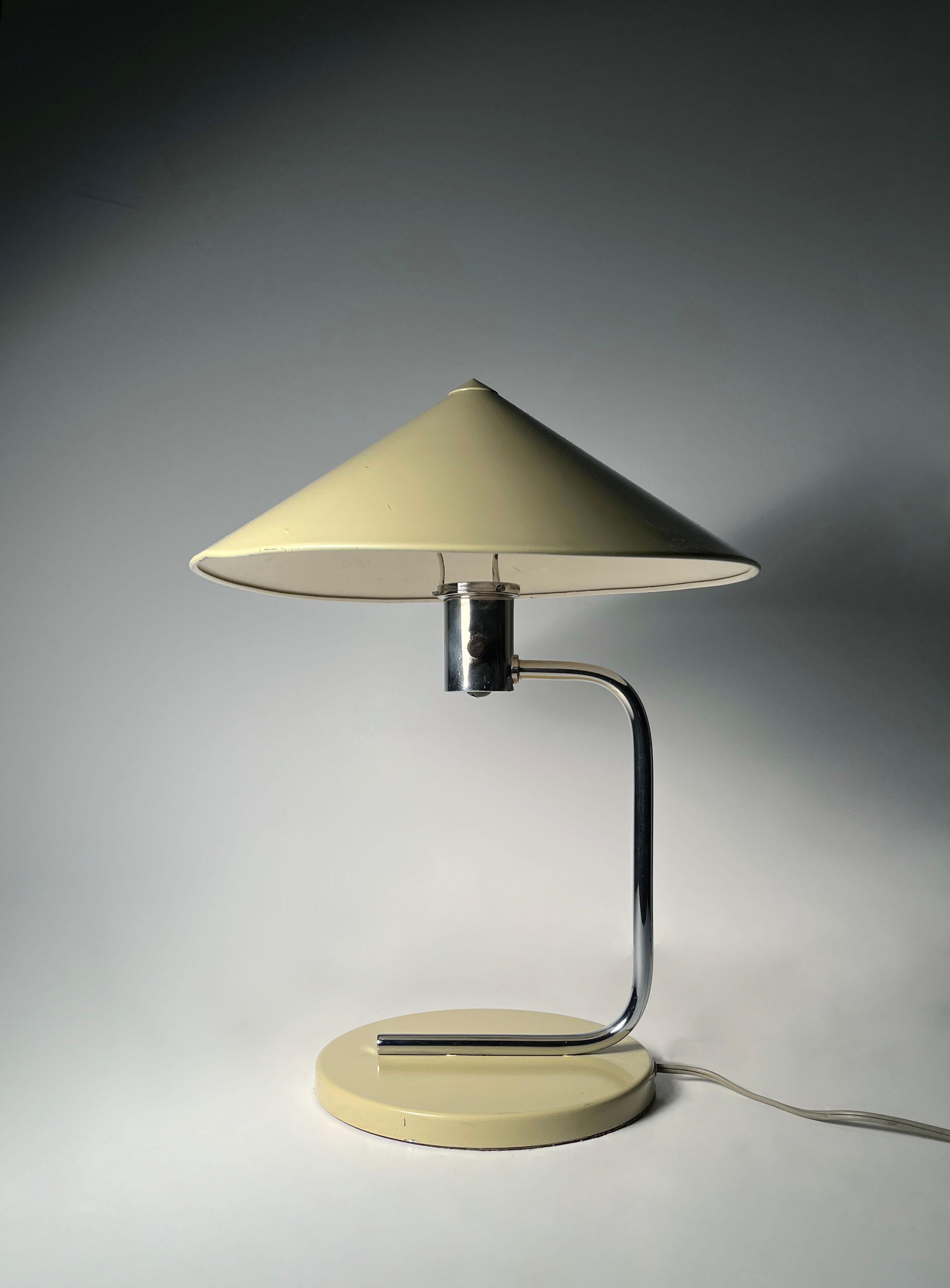 Fairly rare Art Deco Table Lamp by Walter Von Nessen

uncertain if the parts were repainted at some point in time Ivory White. Or if this was factory painted this way.  My hunch is that the shade and base were repainted. A nice color clean modern