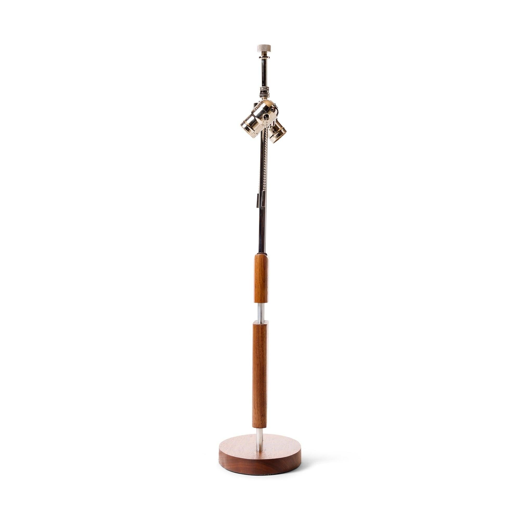 A solid walnut and chrome table lamp.