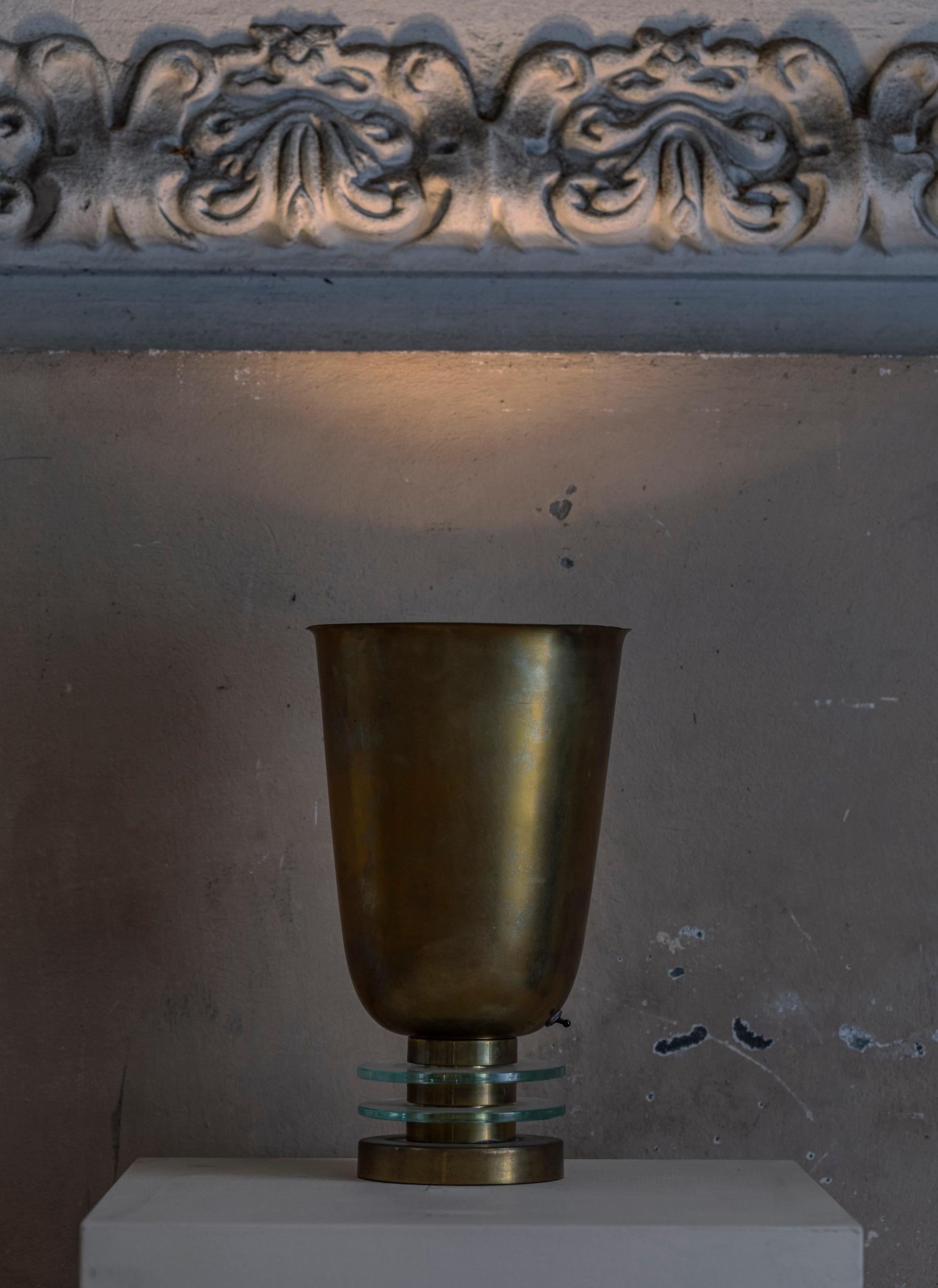 Art Deco golden brass table lamp decorated with beautiful clear glass details.
Italy 1930 circa.