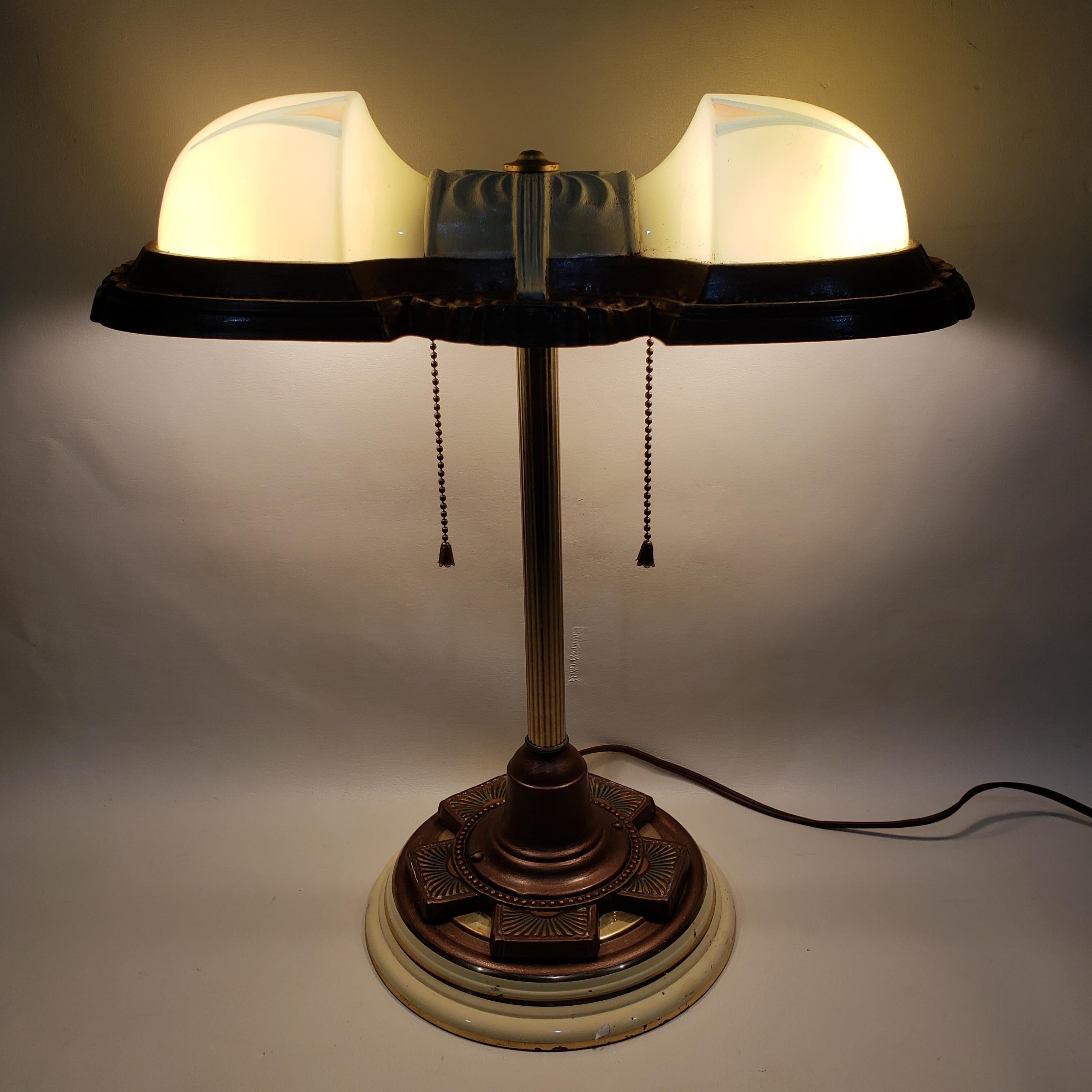 Two light Art Deco table lamp with light mint green shades and a decorative metal base.
