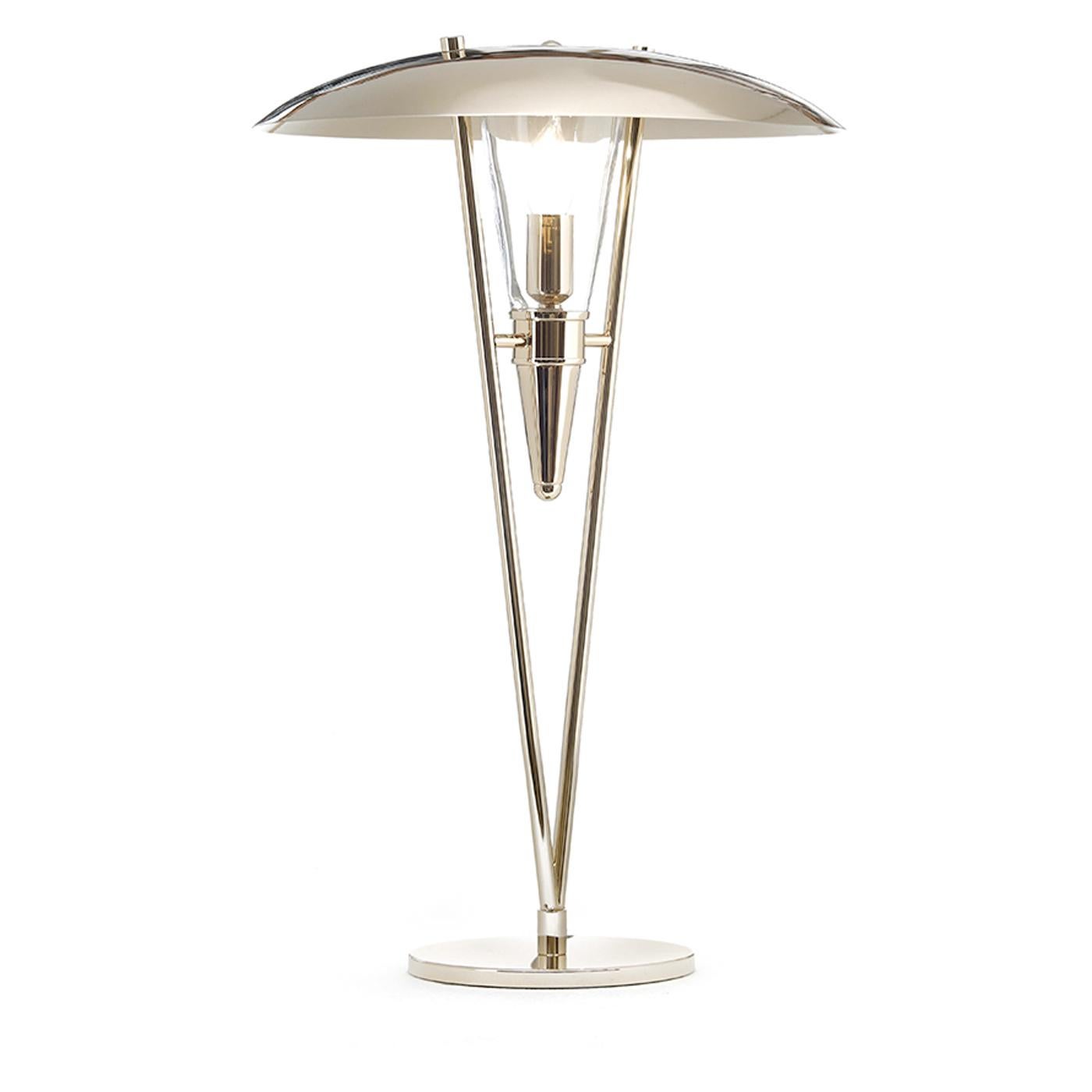 Part of the Art Deco collection, inspired by the geometric rigor and bold silhouettes of home decor from the 1930s and 1940s, this metal table lamp's frame has a striking gold finish, handmade by skillful craftsmen. The round base supports a