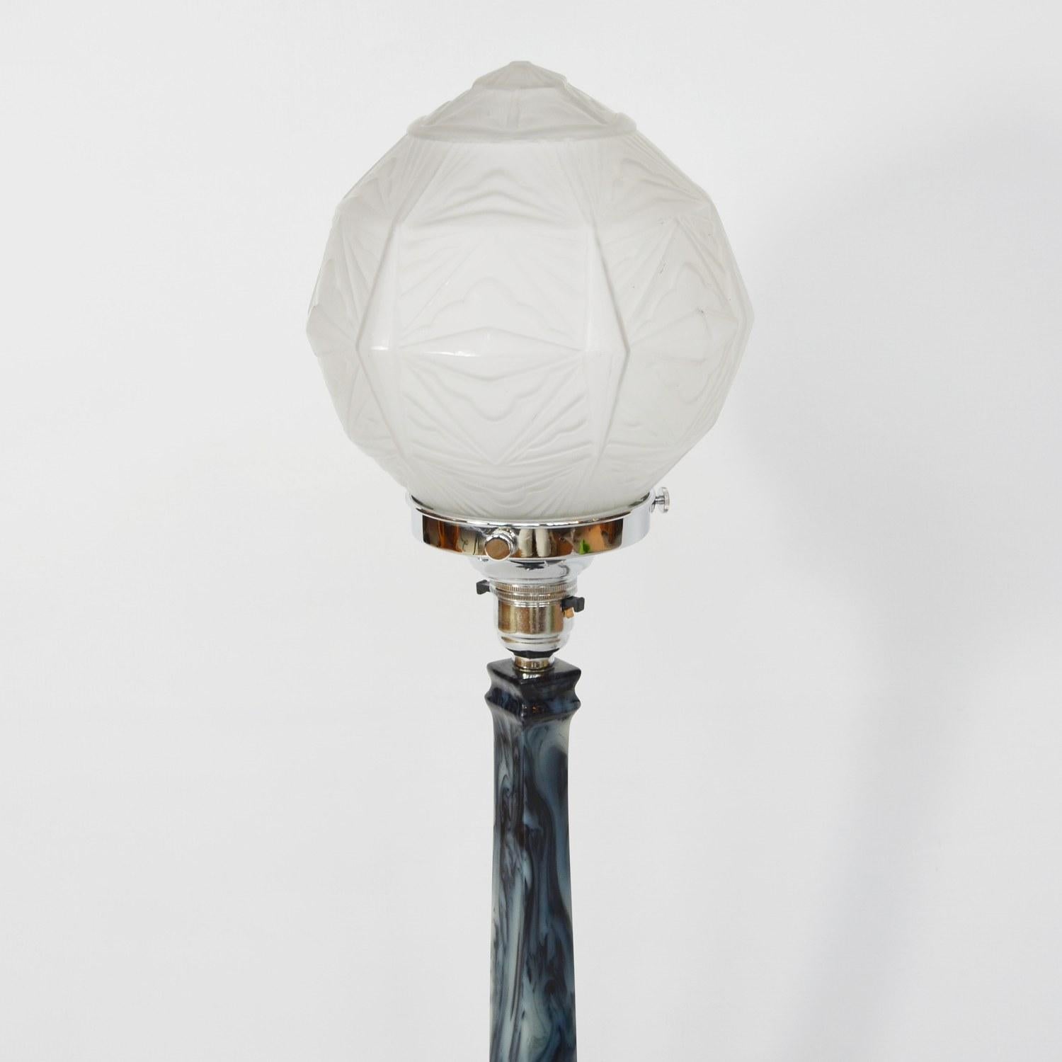 An Art Deco table lamp. Blue and white marbled Catalin stem and base, with a multifaceted frosted globe shade.

Dimensions: H 20 cm, W 12.5 cm

Origin: English

Item no: 210204

All of our lighting is fully refurbished, re-wired, and
