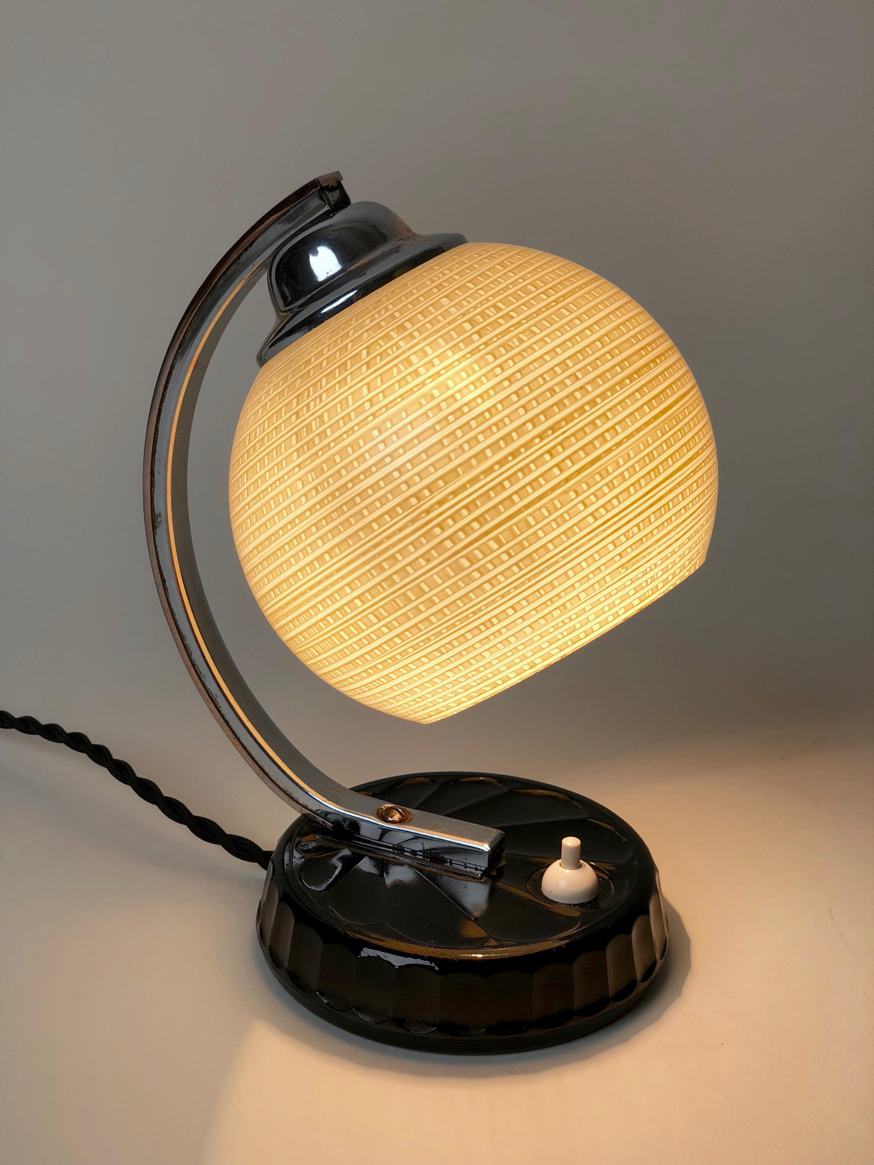 Art Deco table lamp from the Czech Republic, produced in the 1920s-1930s, from CMS Krasno. The base of the lamp looks like it is made of Bakelite, but in fact, it is made from Industrial ceramic, and glazed to look similar to Bakelite. On the bottom