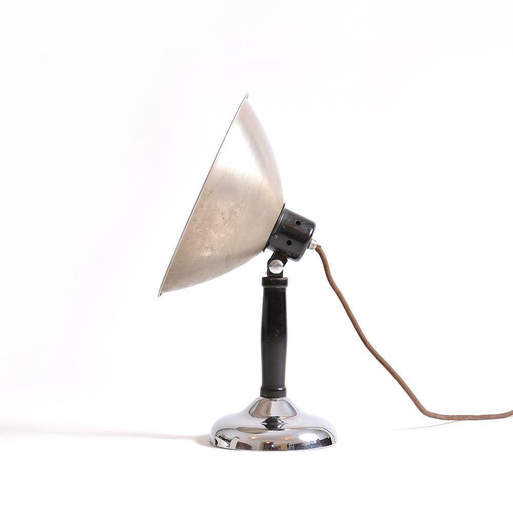 Originally this item was used as a photo lamp by a professional photographer to create a great light in a studio in the beginning of the 20th century. This is a great table lamp from the art deco era and was produced in 1920s in Czechoslovakia. Now