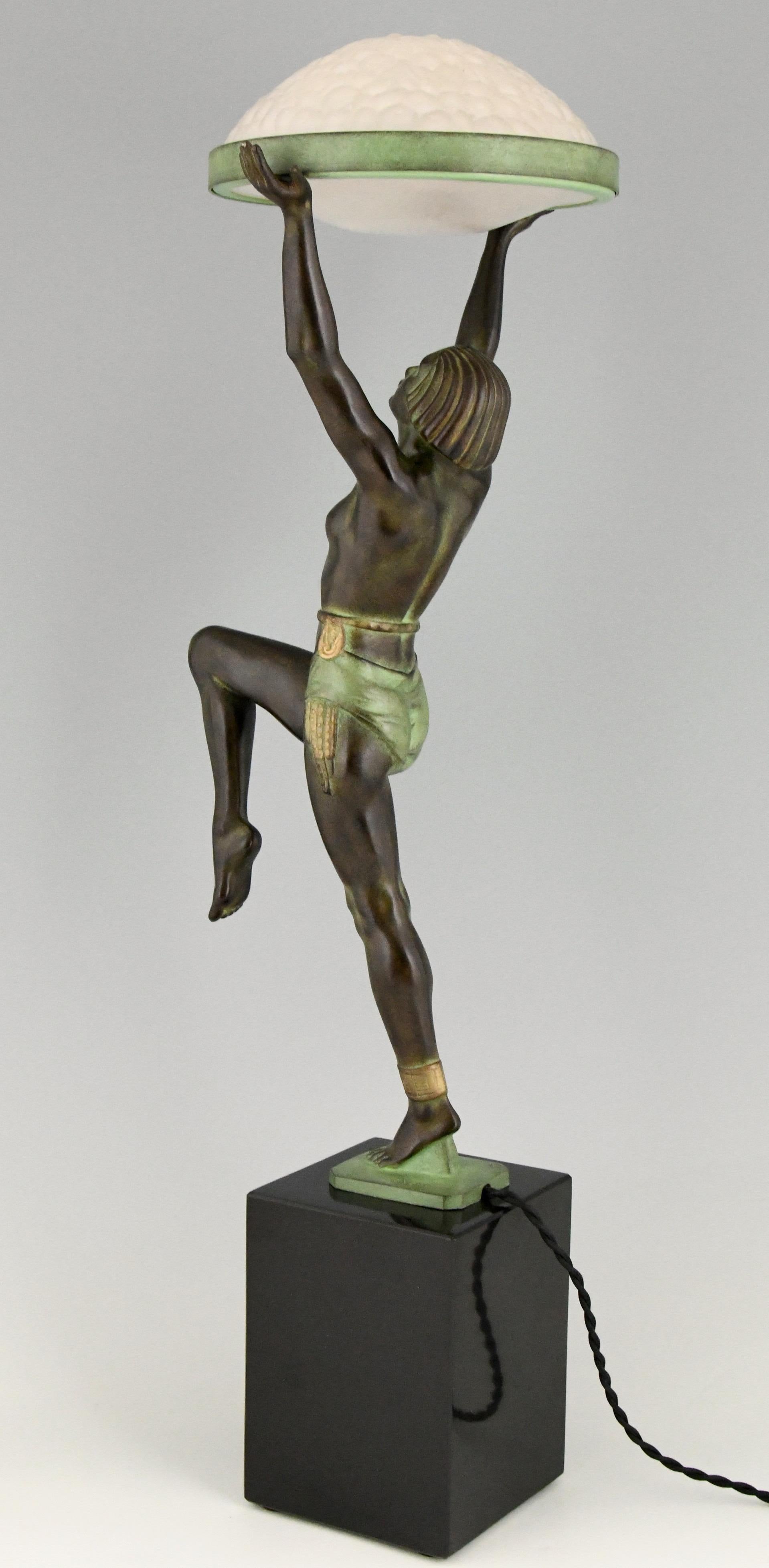 Patinated Art Deco Style Table Lamp of a Dancer Holding a Glass Shade Max Le Verrier