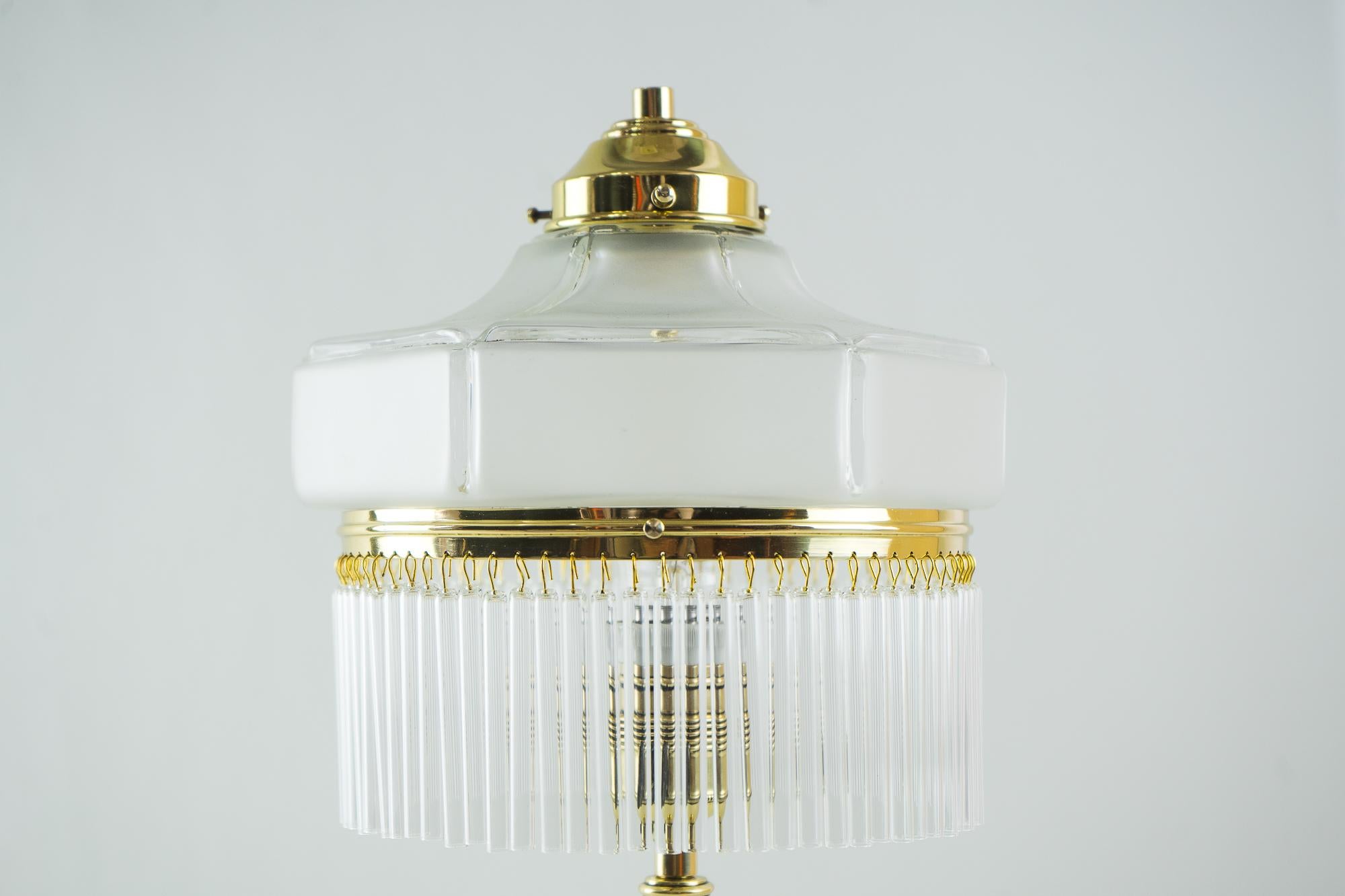 Art Deco table lamp, Vienna, 1920s
Brass polished and stove enameled
Original glass shade
The glass sticks are replaced (new).