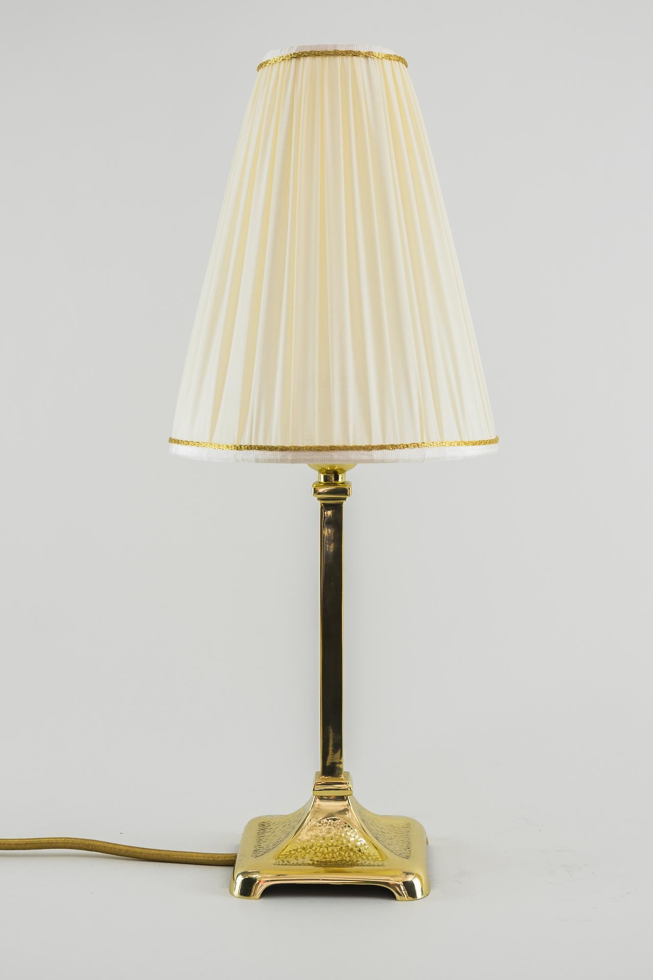 Art Deco table lamp, Vienna, 1920s 
Brass hammered 
Polished and stove enameled
Shade replaced ( New ).
