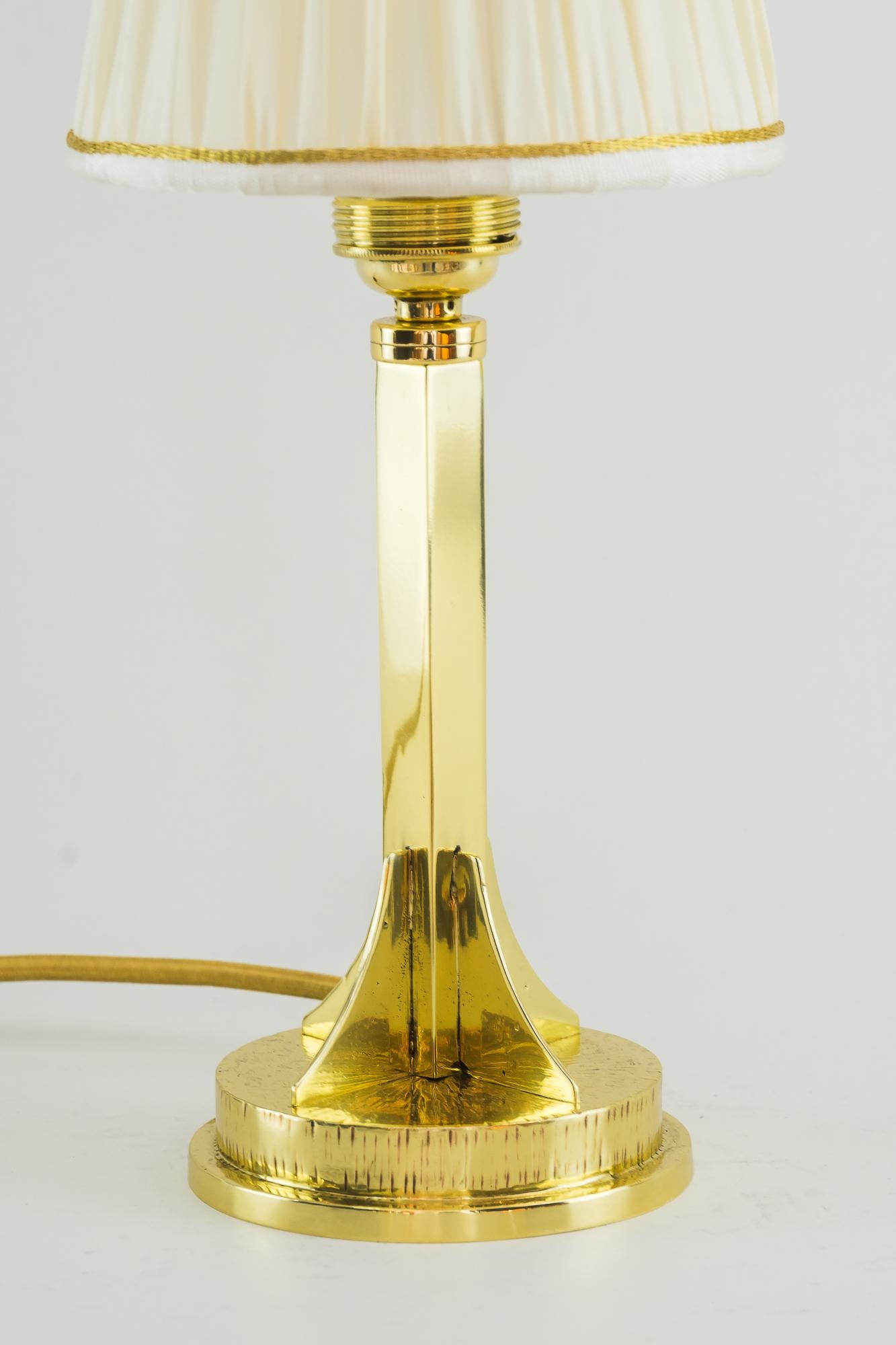 Art Deco table lamp, Vienna, circa 1920.
Brass Hammered
Polished and stove enameled
Shade replaced (new).