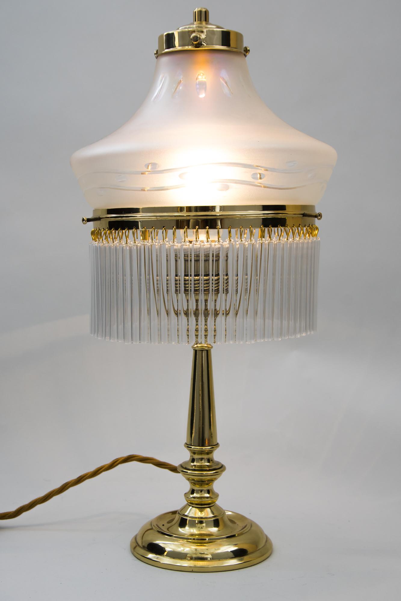 Art Deco table lamp, Vienna, circa 1920s
Brass polished and stove enameled
Original glass shade
Glass sticks are replaced.