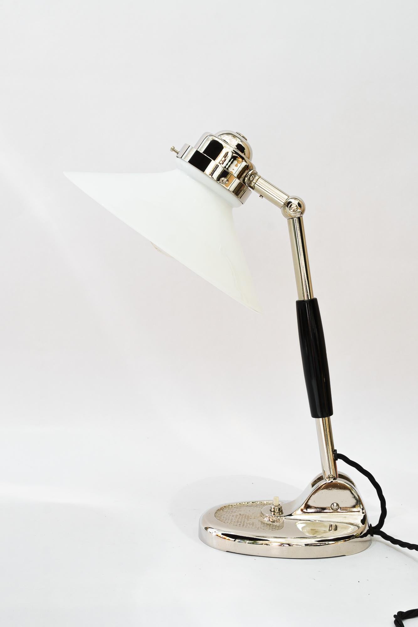 Art Deco Table lamp vienna around 1920s
Metal nickel-plated
Original opal glass shade
Wood handle