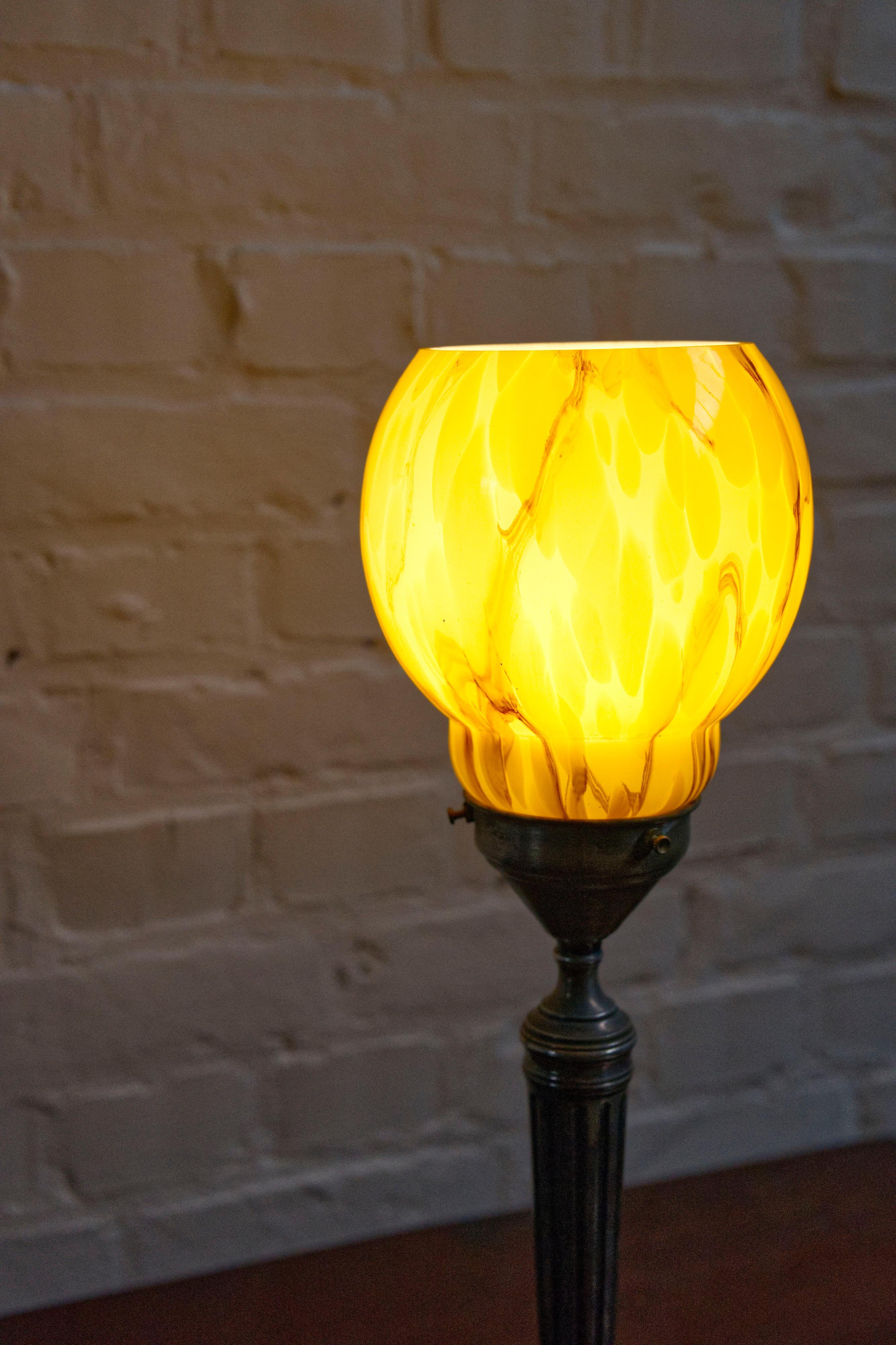 Metal Art deco table lamp with a marbled glass shade, 1930's For Sale