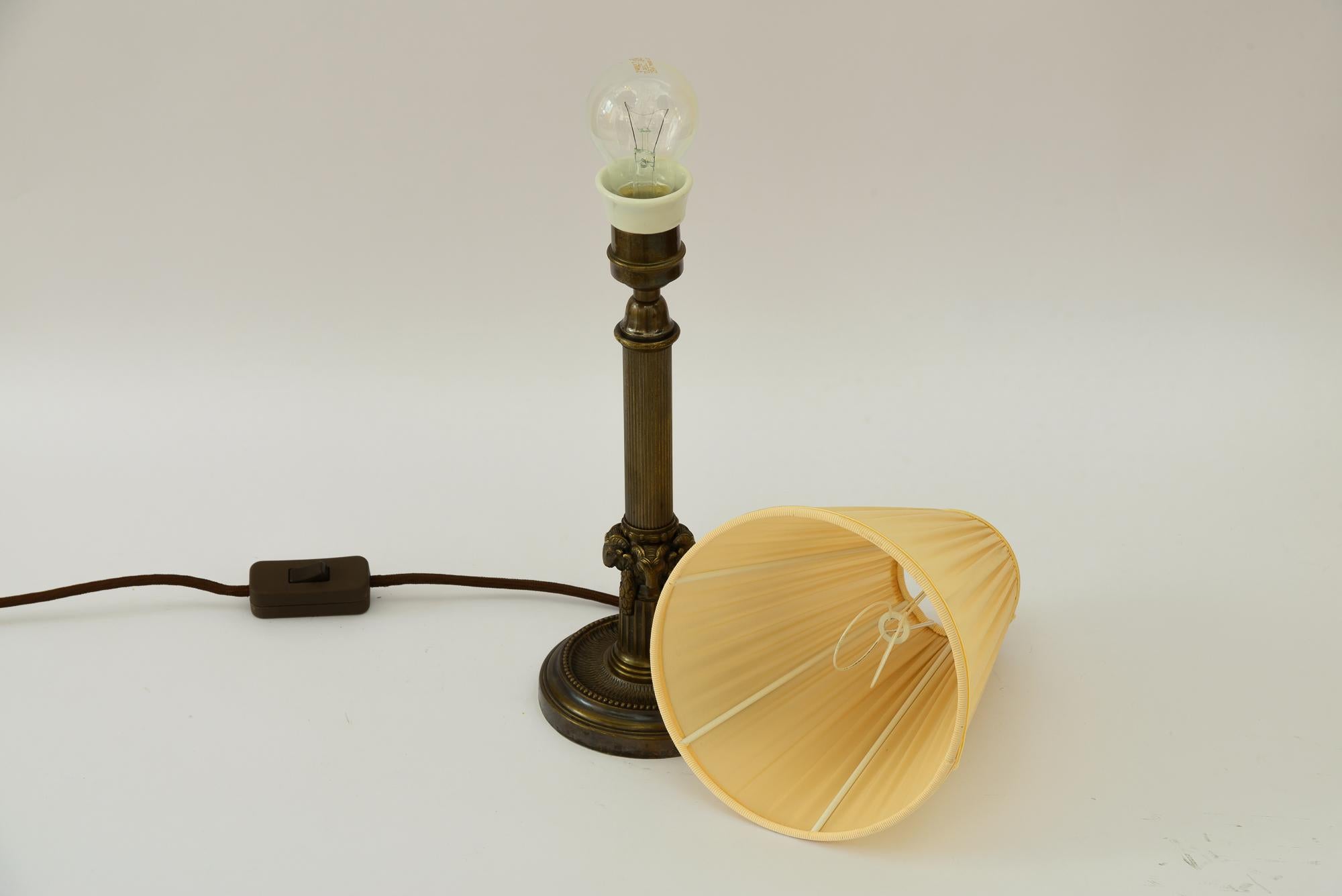 Early 20th Century Art Deco Table lamp with capricorn head with fabric shade vienna around 1920s For Sale