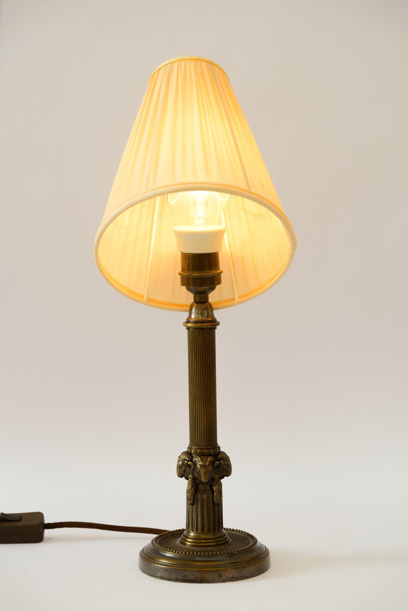 Art Deco Table lamp with capricorn head with fabric shade vienna around 1920s For Sale 1