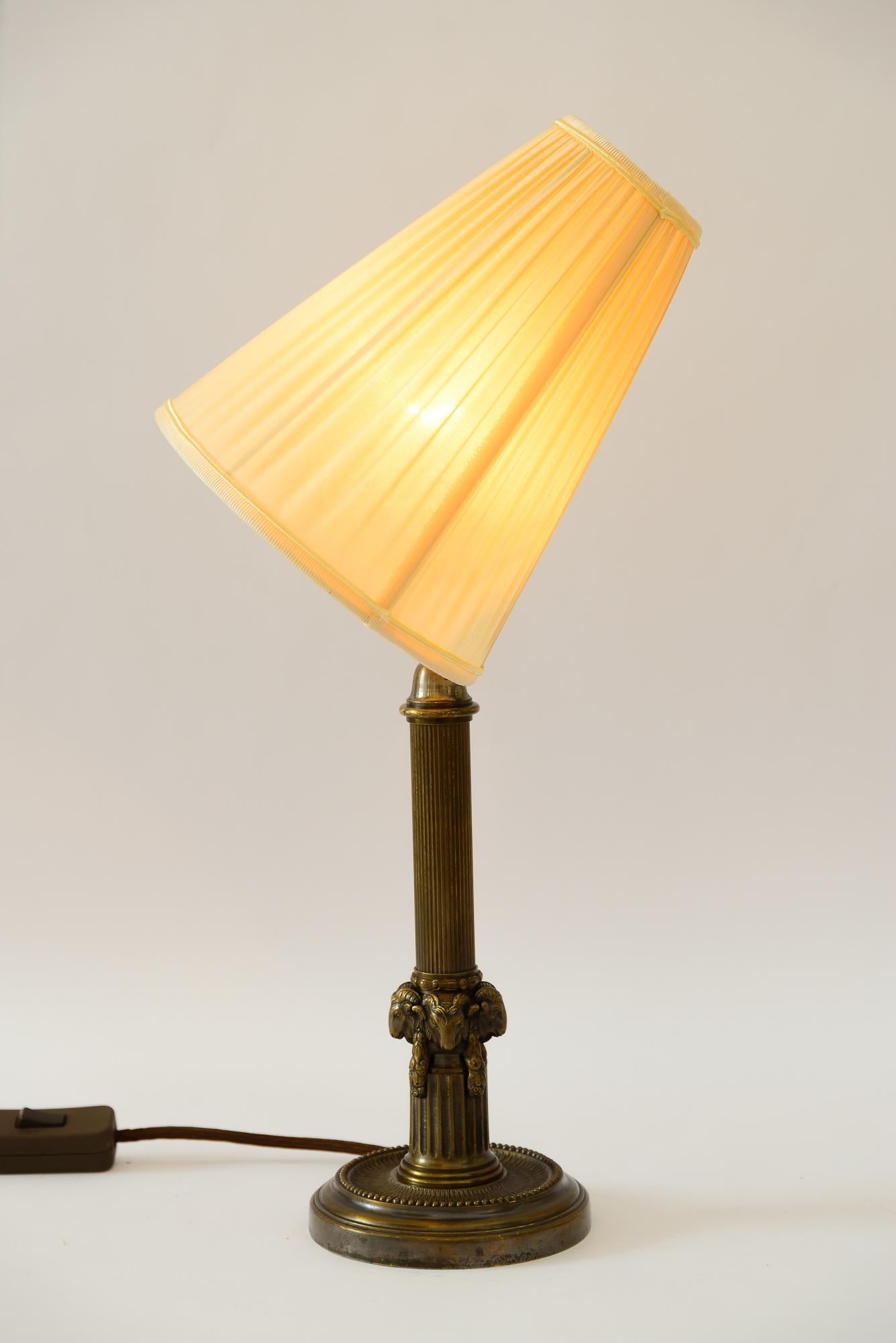 Art Deco Table lamp with capricorn head with fabric shade vienna around 1920s For Sale 2