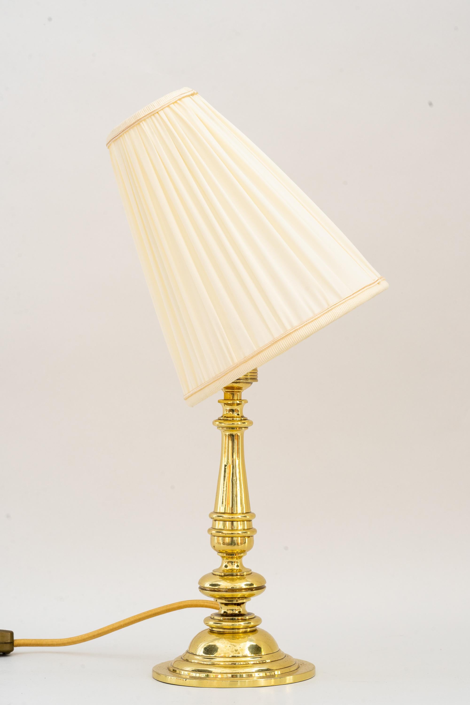Art Deco table lamp with fabric shade vienna around 1920s 
The shade is replaced ( new )
Polished and stove enameled.
