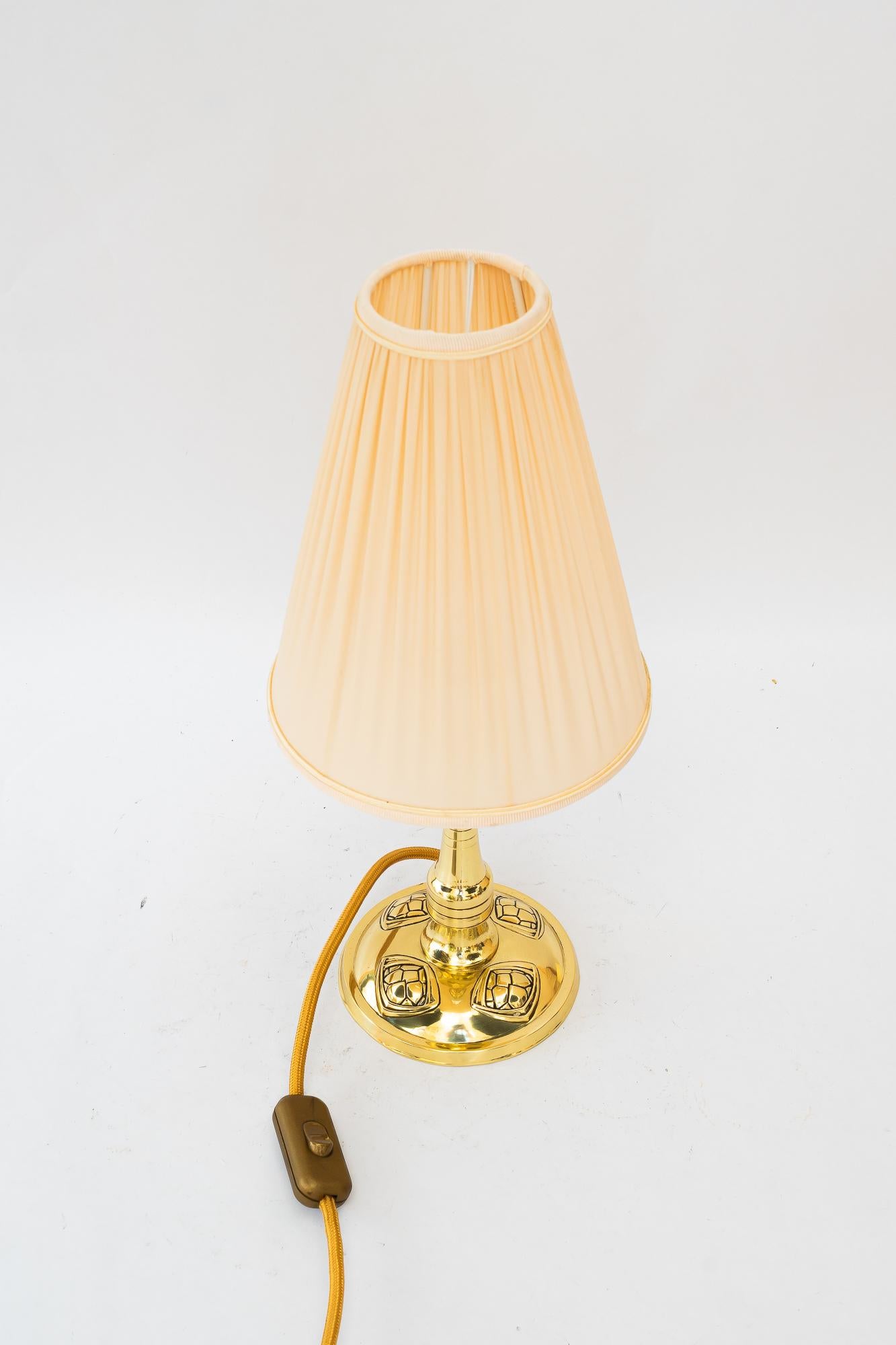 Art Deco table lamp with fabric shade vienna around 1920s
Brass polished and stove enameled
The fabric shade is replaced ( new )