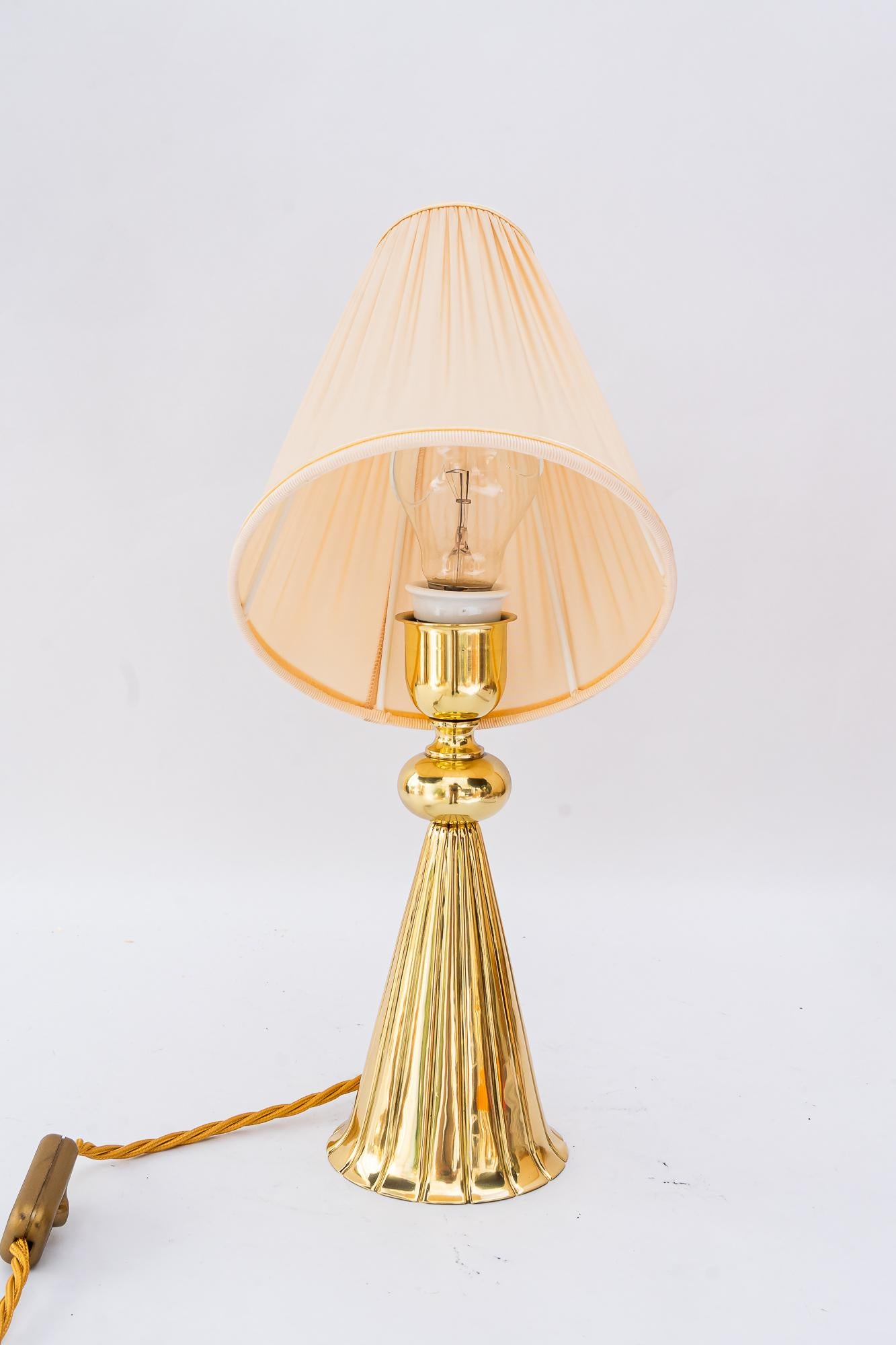 Art Deco table lamp with fabric shade vienna around 1920s
Brass polished and stove enameled
The fabric shade is replaced ( new )