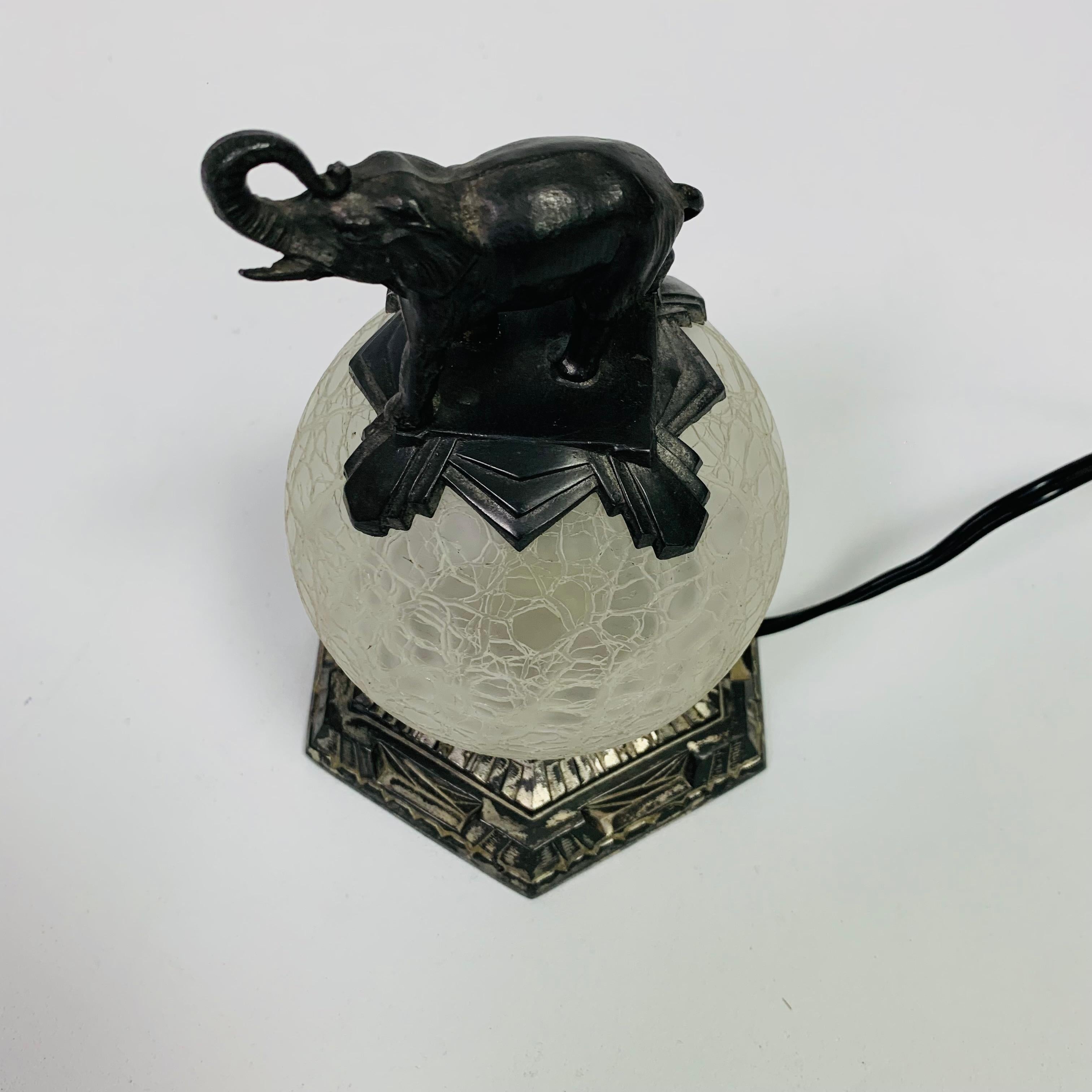 Art Deco table lamp with glass ball and elephant on top, 1930s In Good Condition In EINDHOVEN, NL