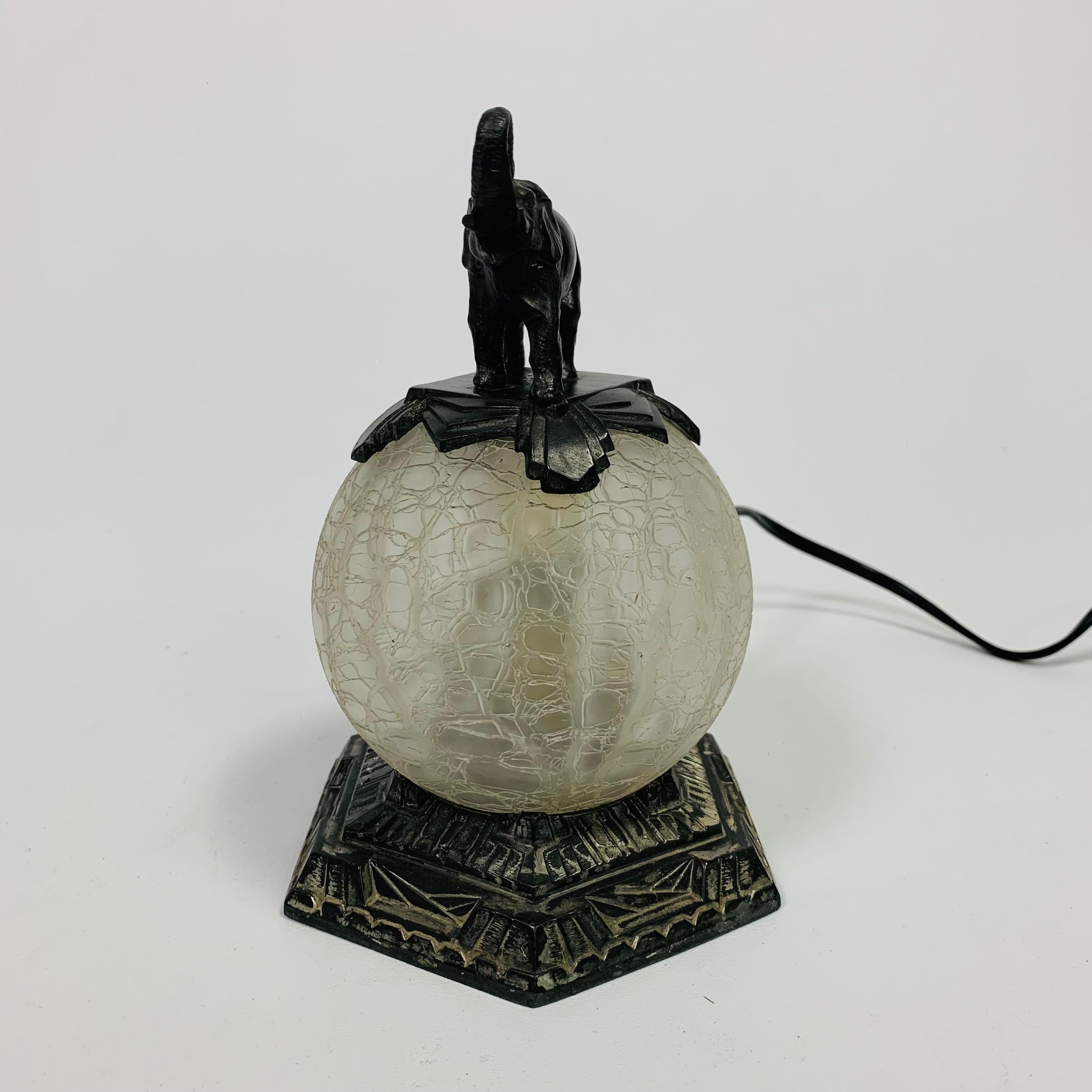 Mid-20th Century Art Deco table lamp with glass ball and elephant on top, 1930s