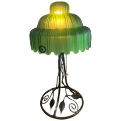 Art Deco Table lamp with green glass shade and iron base