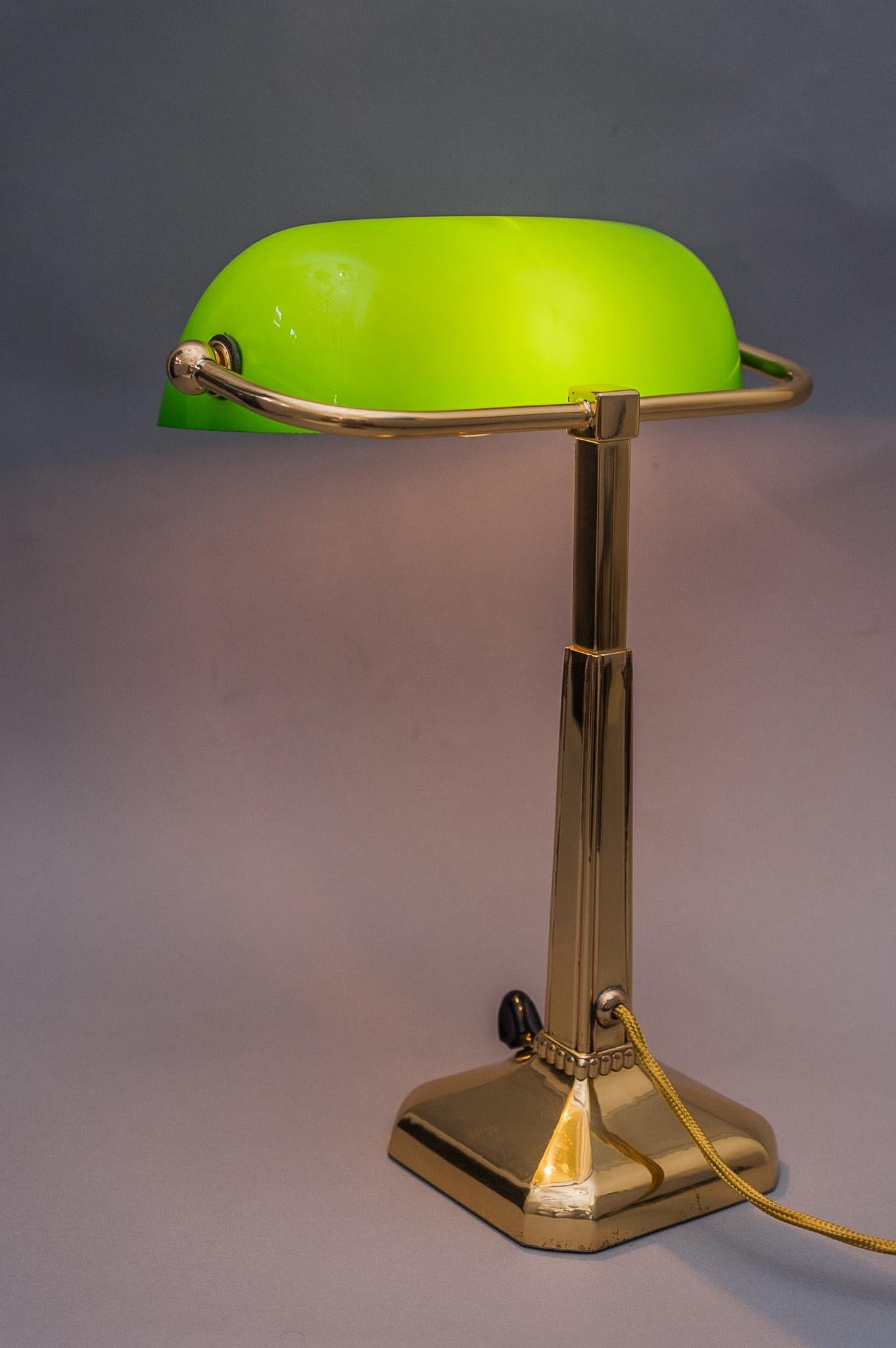 Art Deco table lamp with green shade.
Polished and stove enameled.

Glass shade is replaced (new).
