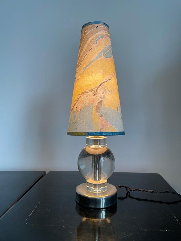 The crystal ball is mounted an a chrome base
Size crystal base 10cm Dia x 120cm H including bulb socked
Total height table lamp: base with lamp shade 40cm,
Lamp shade is hand crafted in our atelier in Germany , We have used a silk which is hand