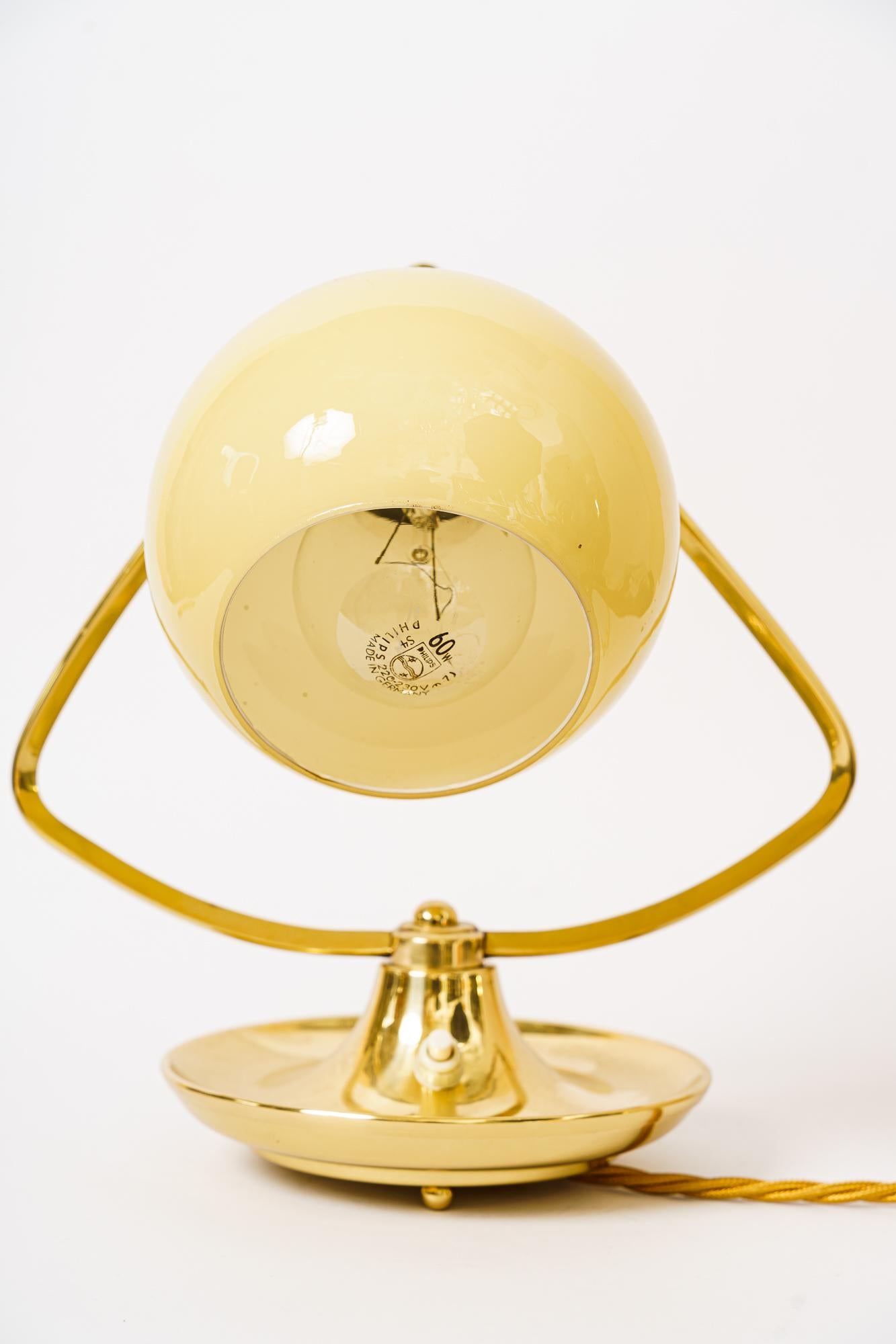 Art Deco table lamp with opal glass shade vienna, circa 1920s.
Brass polished and stove enameled.
