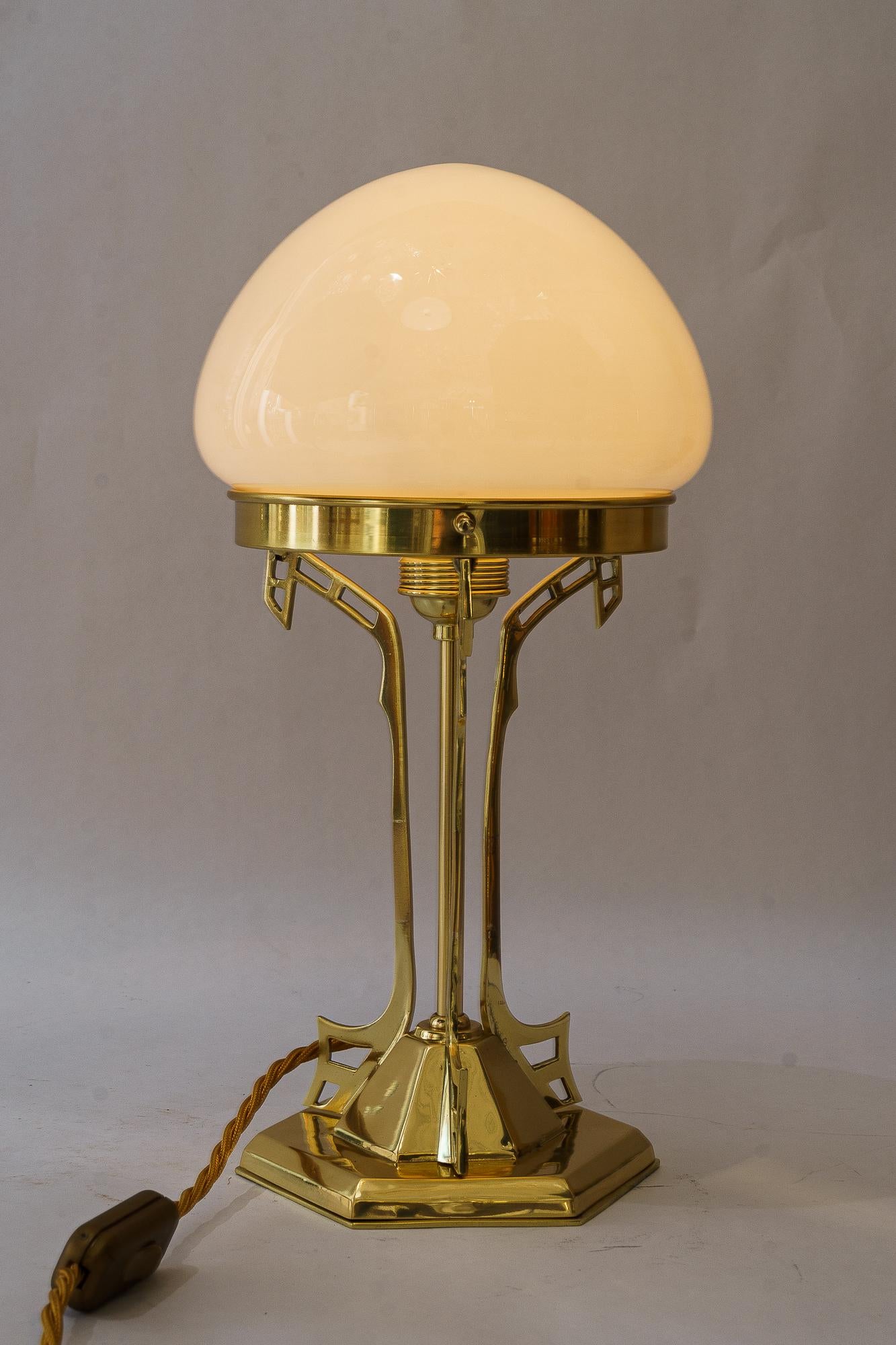 Art Deco Table lamp with opal glass shade vienna around 1920s
Brass polished and stove enameled
Original antique opal glass shade