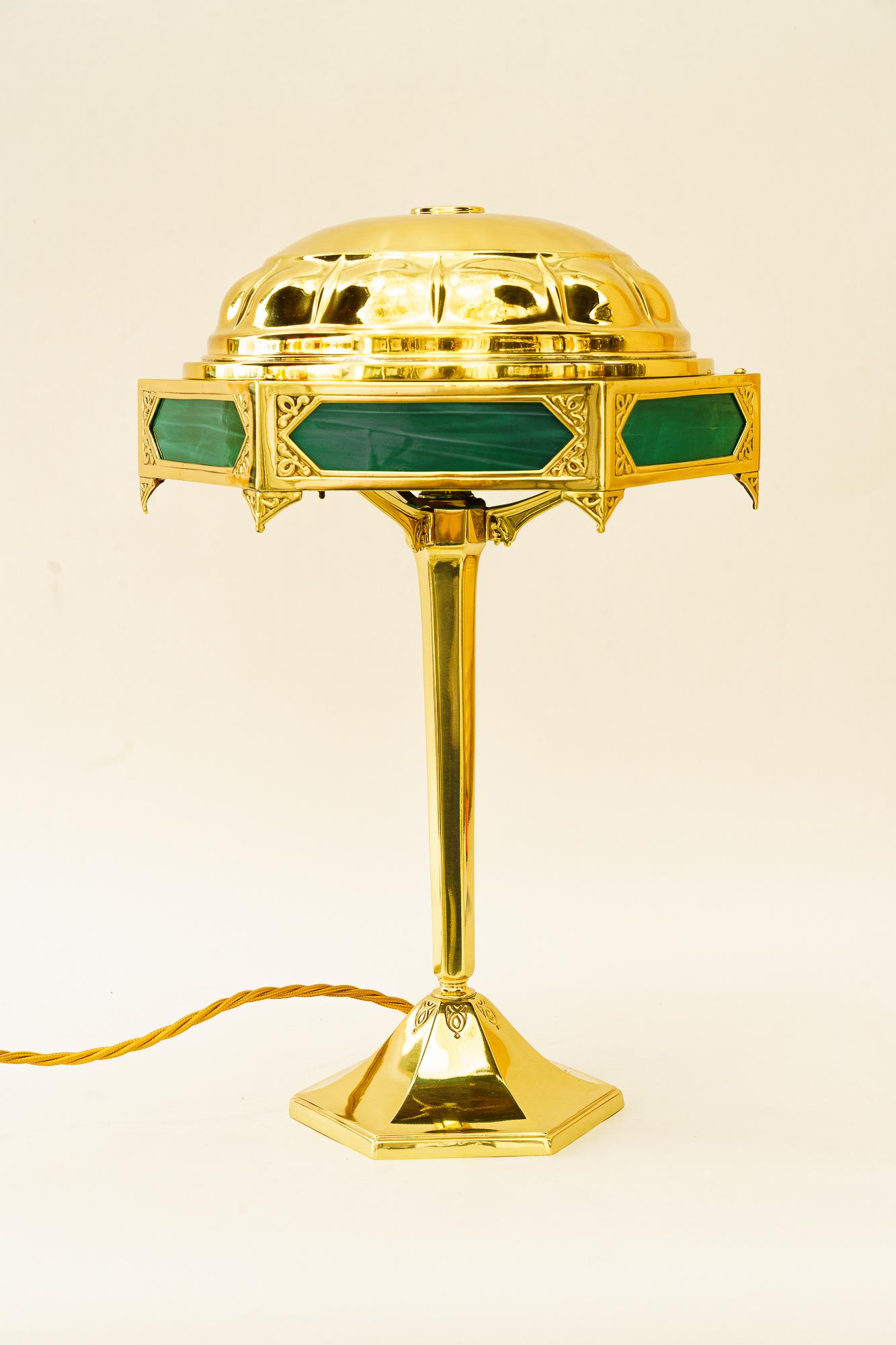 Art Deco table lamp with original antique opaline glass plates vienna around 1920s
Brass polished and stove enameled
