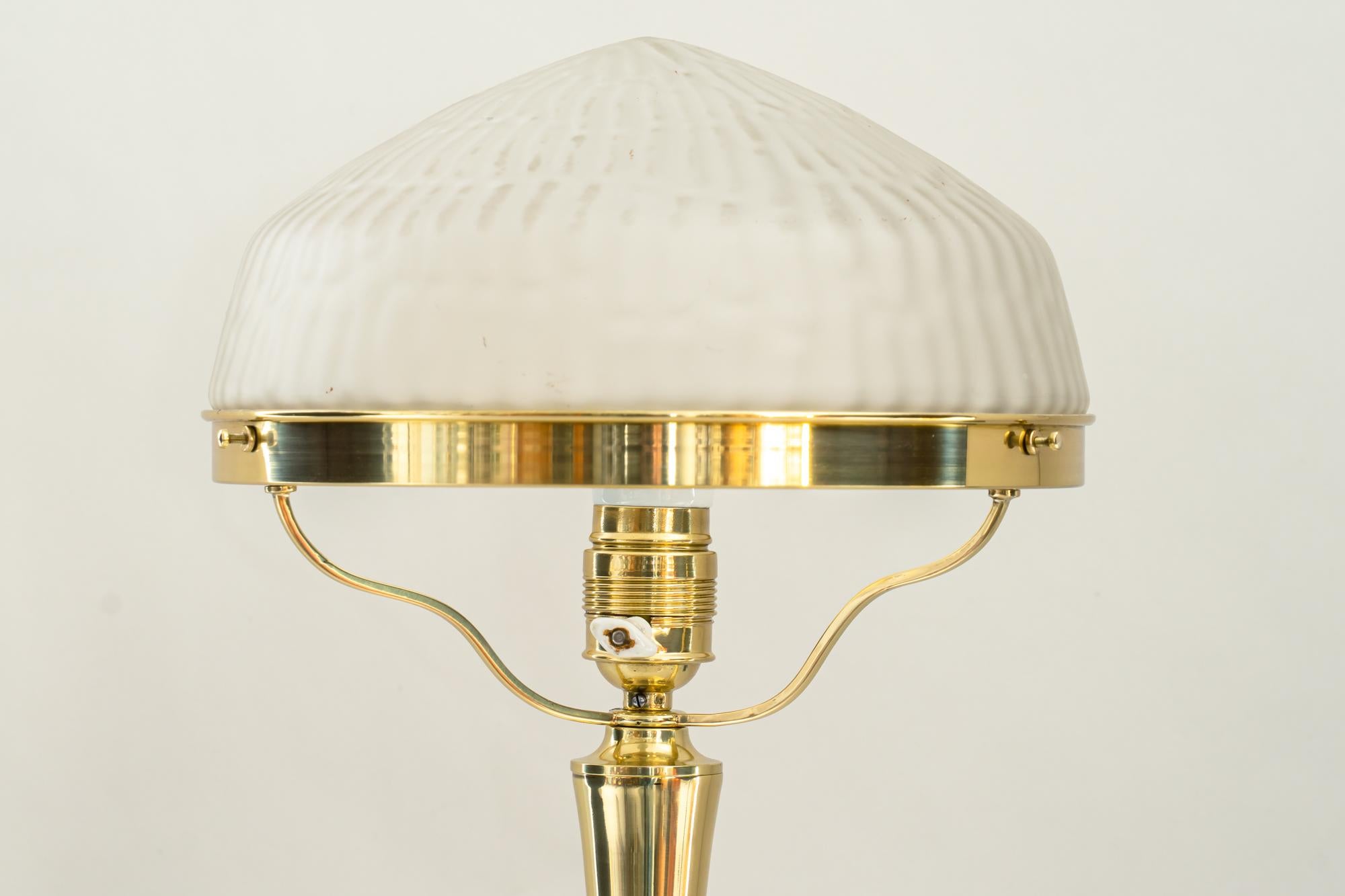 Art Deco table lamp with original glass shade around 1920s
Polished and stove enameled
Original glass shade.