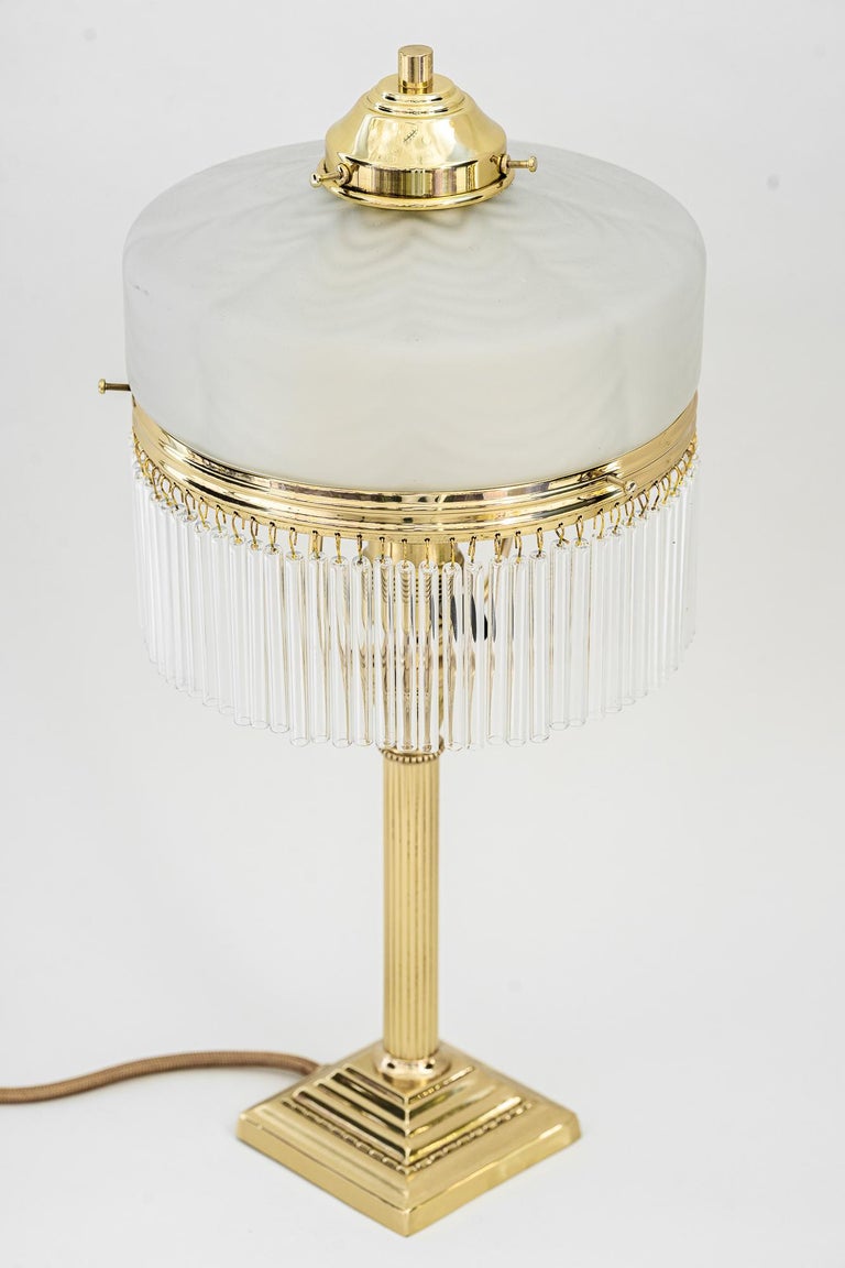Art Deco Table Lamp with original glass shade around 1920s
Polished and stove enamelled
Original glass shade
The glass sticks are replaced (new).