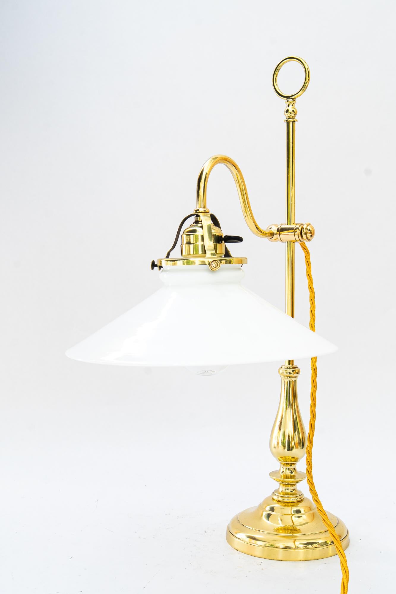 Art Deco Table lamp with original opal glass shade vienna around 1920s
Brass polished and stove enameled
Original opal glass shade