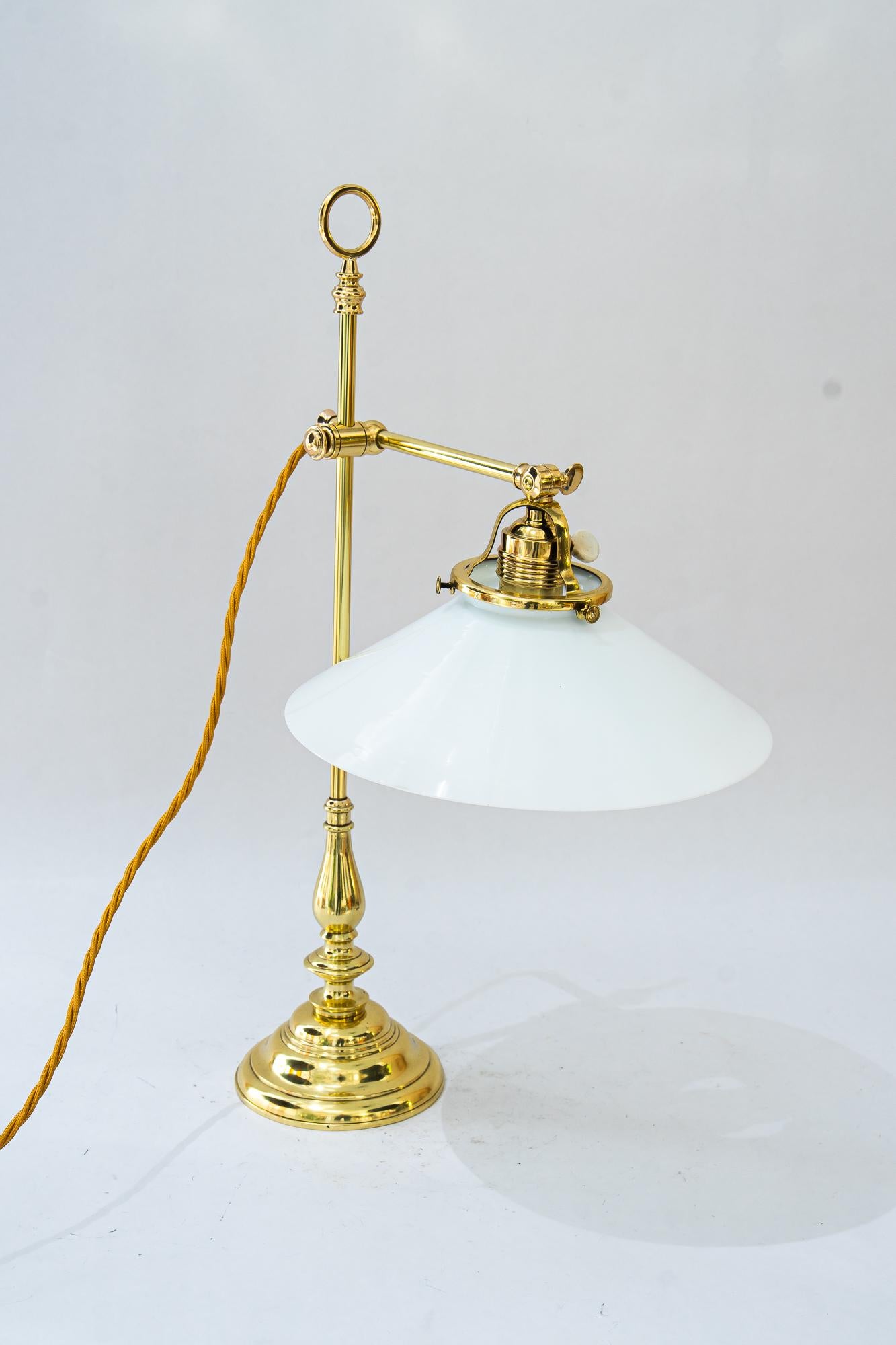 Art Deco Table lamp with original opal glass shade vienna around 1920s
Brass polished and stove enameled
Original opal glass shade