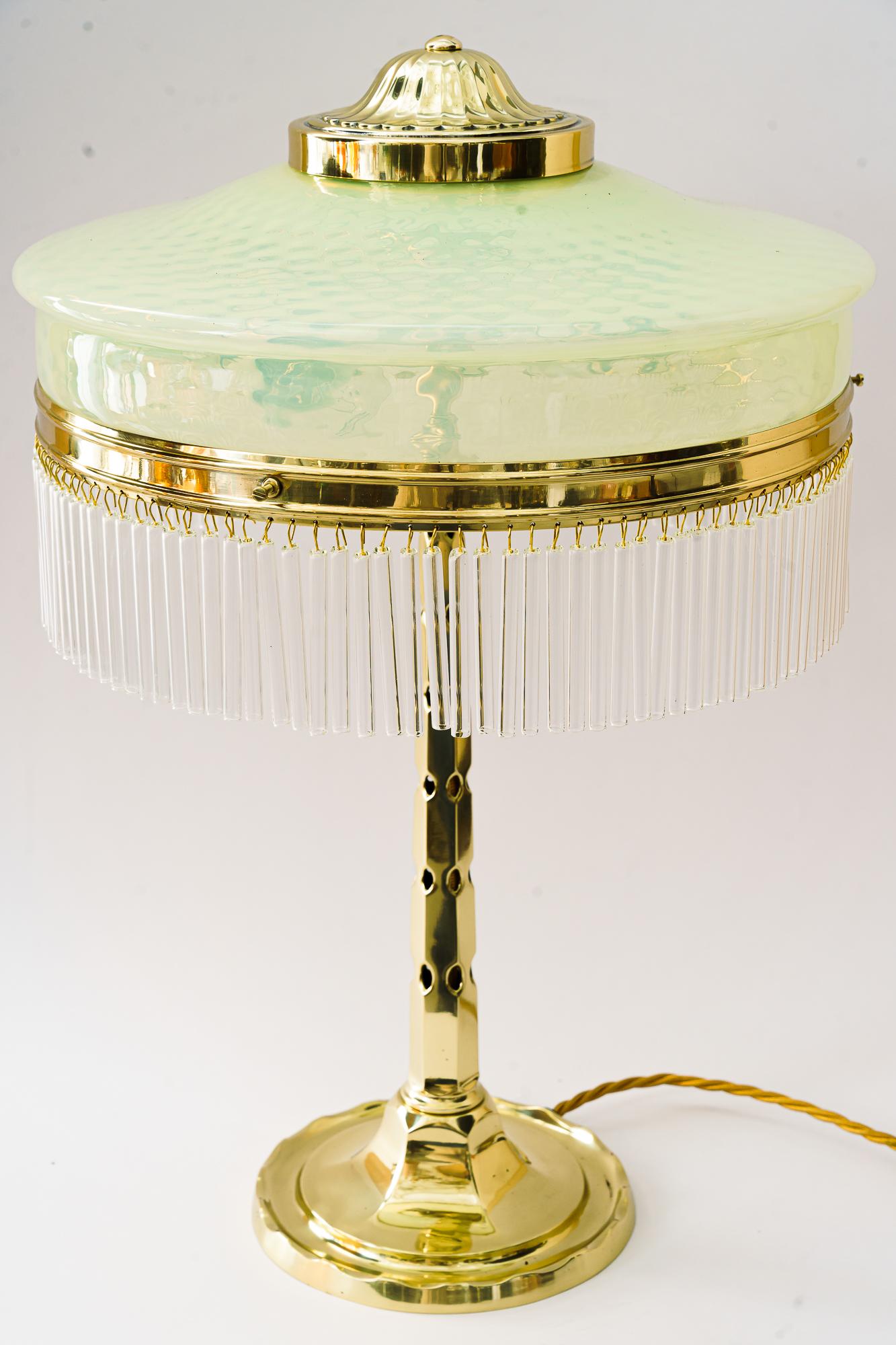 Art Deco table lamp with originla opaline glass shade vienna around 1920s 
Polished and stove enameled
Original opaline glass shade
The glass sticks are replaced ( new ).