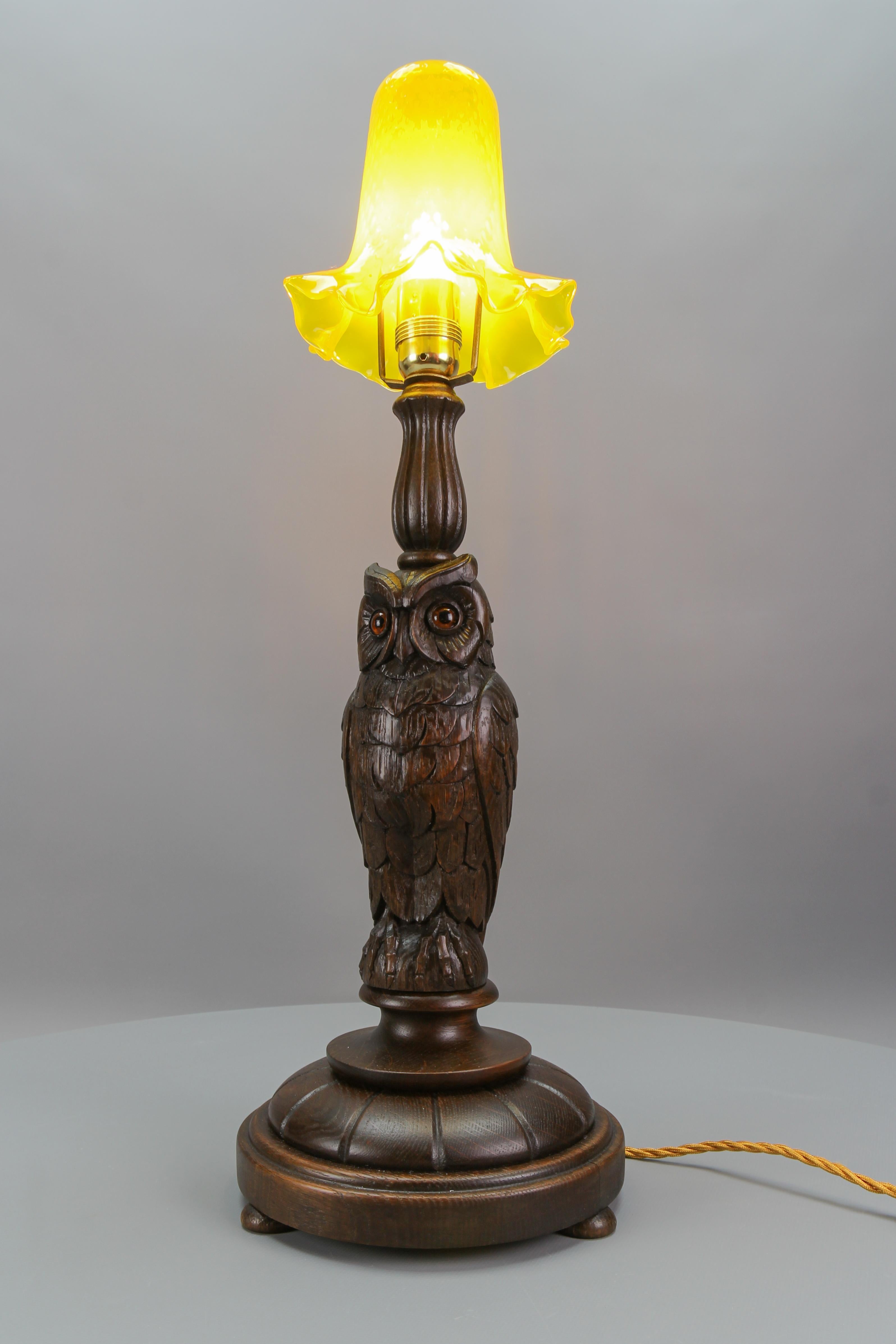 German Art Deco Table Lamp with Owl Sculpture and Yellow Glass Lampshade, ca. 1920 For Sale