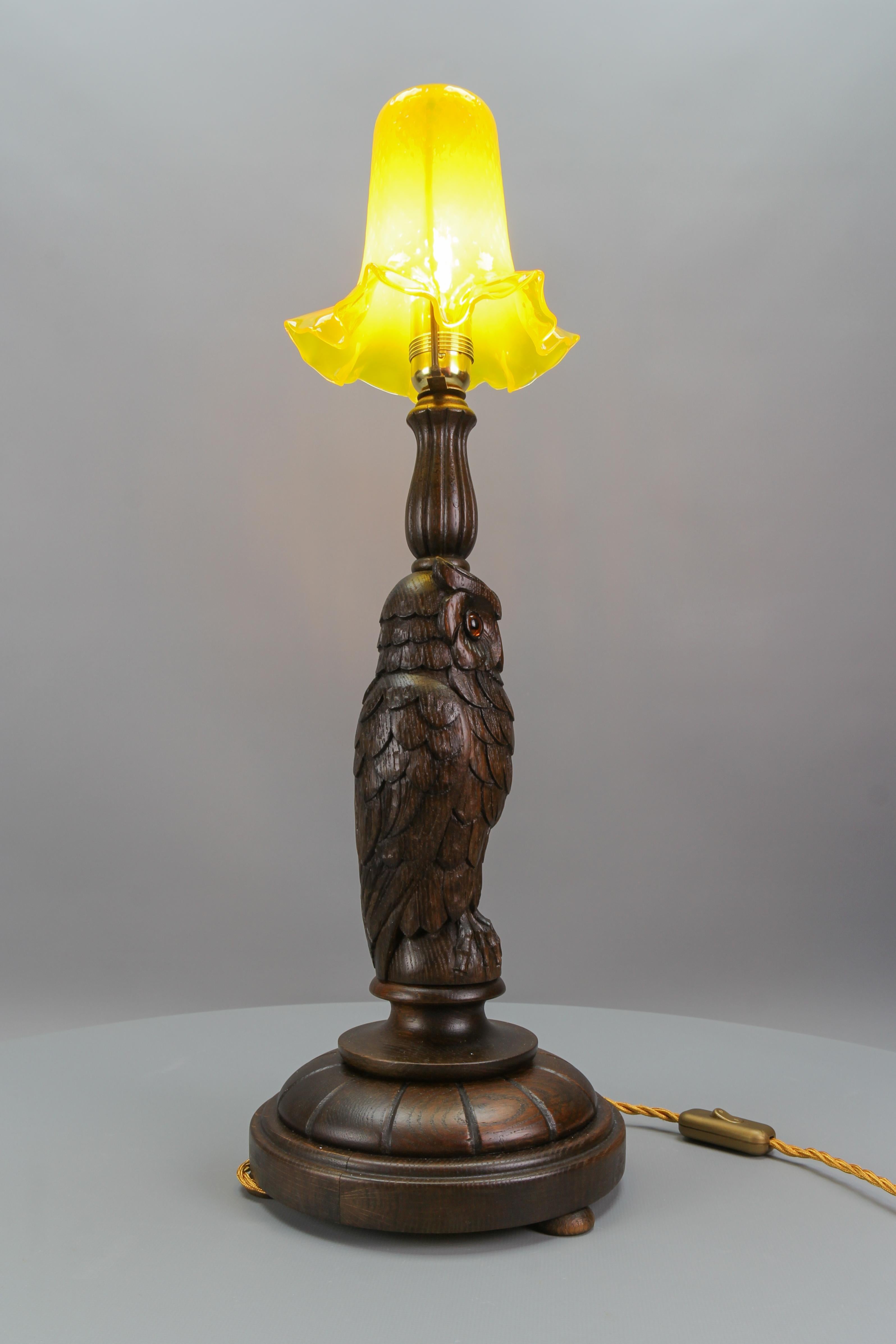 Metal Art Deco Table Lamp with Owl Sculpture and Yellow Glass Lampshade, ca. 1920 For Sale