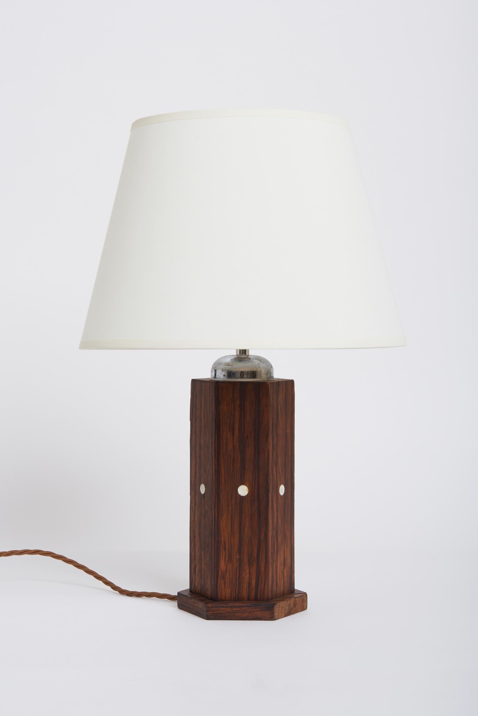 An Art Deco Macassar ebony table lamp by Jules Leleu (1883-1961).
Stamped.
France, Circa 1930.
With the shade: 43 cm high by 26 cm diameter.
Lamp base only: 31 cm high by 12 cm diameter.