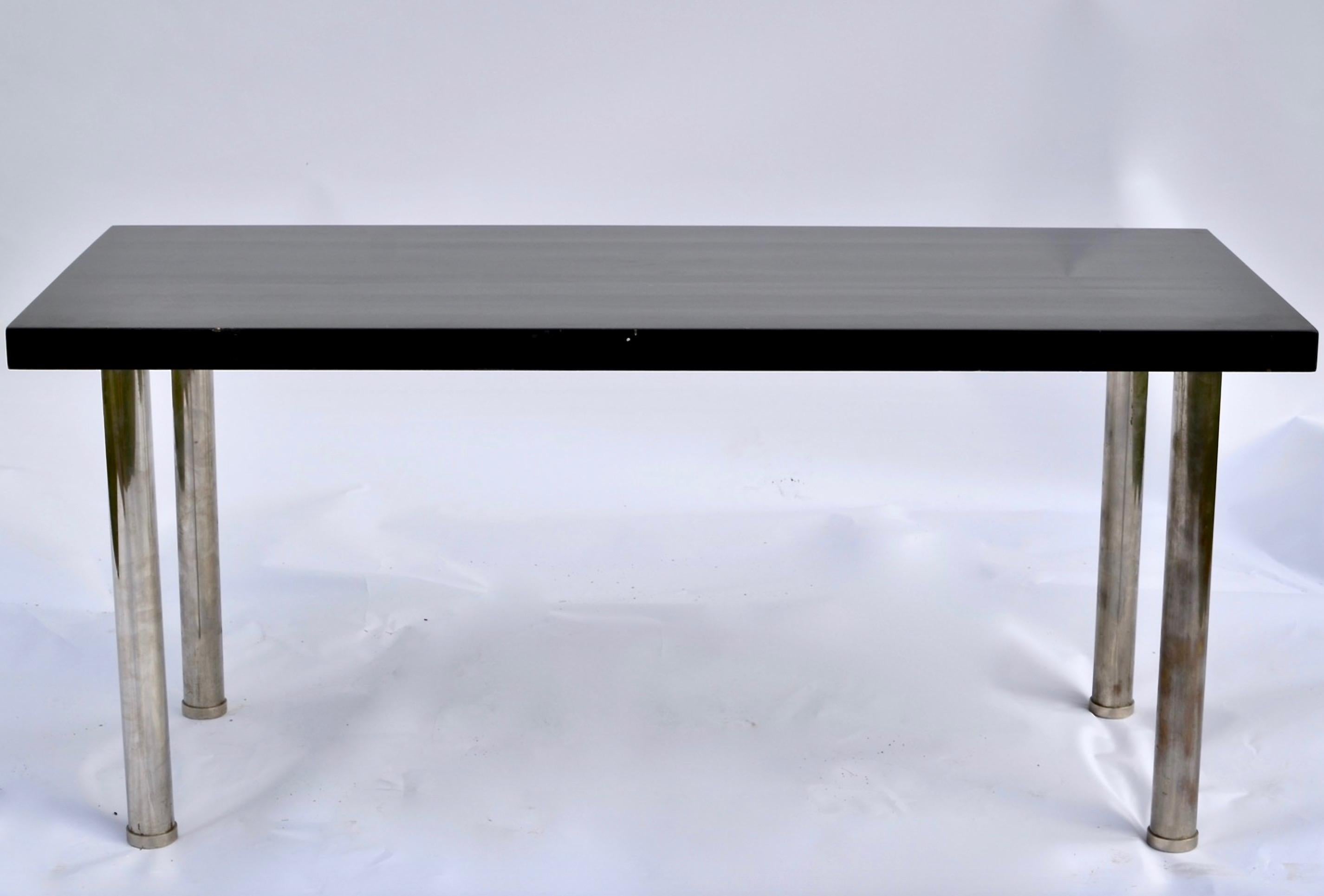 A Swedish Art Deco table with a brass plate “Nordiska Kompaniet, Stockholm”. Numbered and made in 1932. Legs chromed and the tabletop black lacquered.

Dimensions: Length 150.0 cm (59.1 inches) x depth 63.0 cm (24.8 inches) x height 67.0 cm (26.4