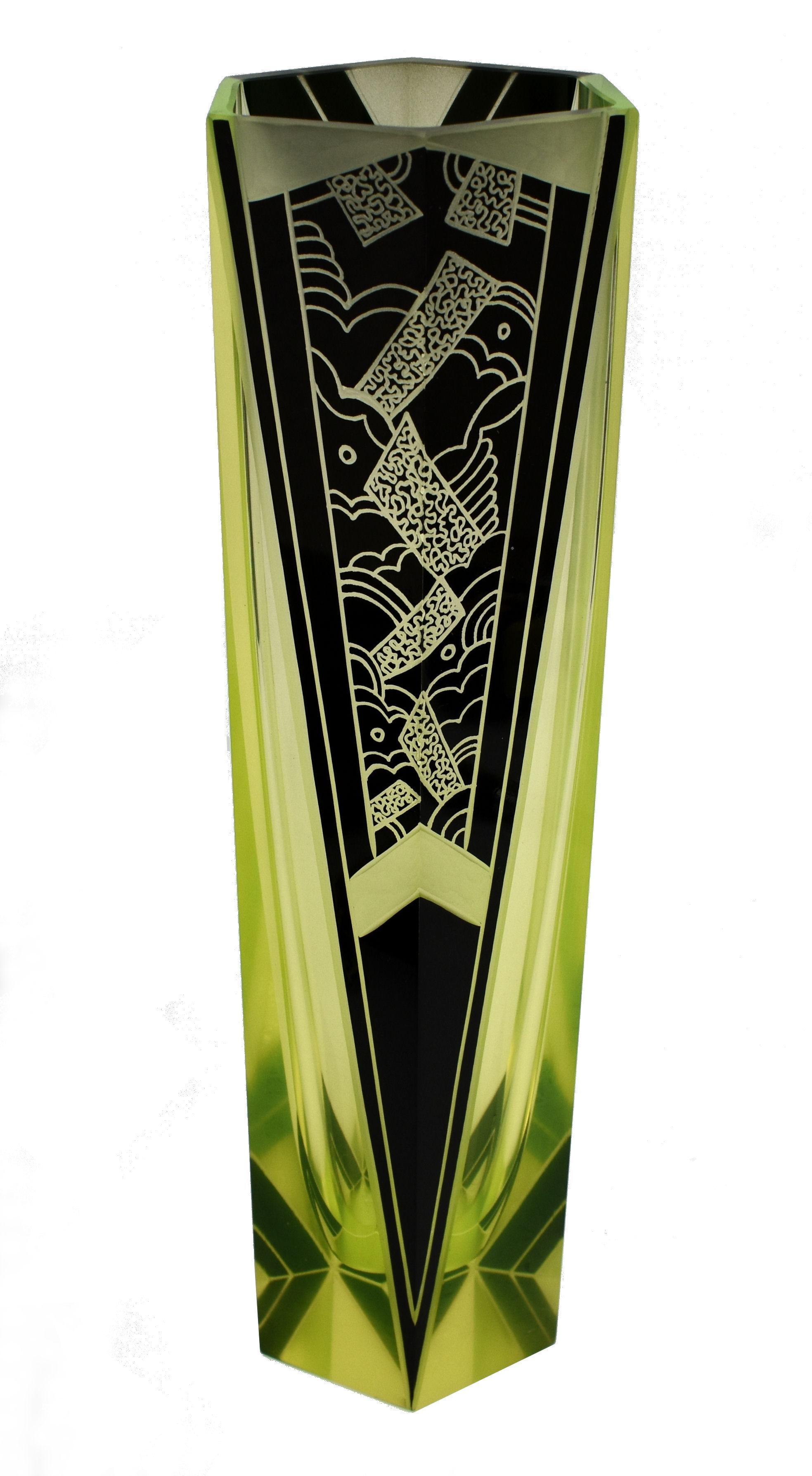 Originating from Czech republic this Art Deco vase not only visually looks stunning with it's very distinctive green / yellow colouring with jet black enamel accents but is a great size standing just over 26 cm. Condition is excellent, can't find