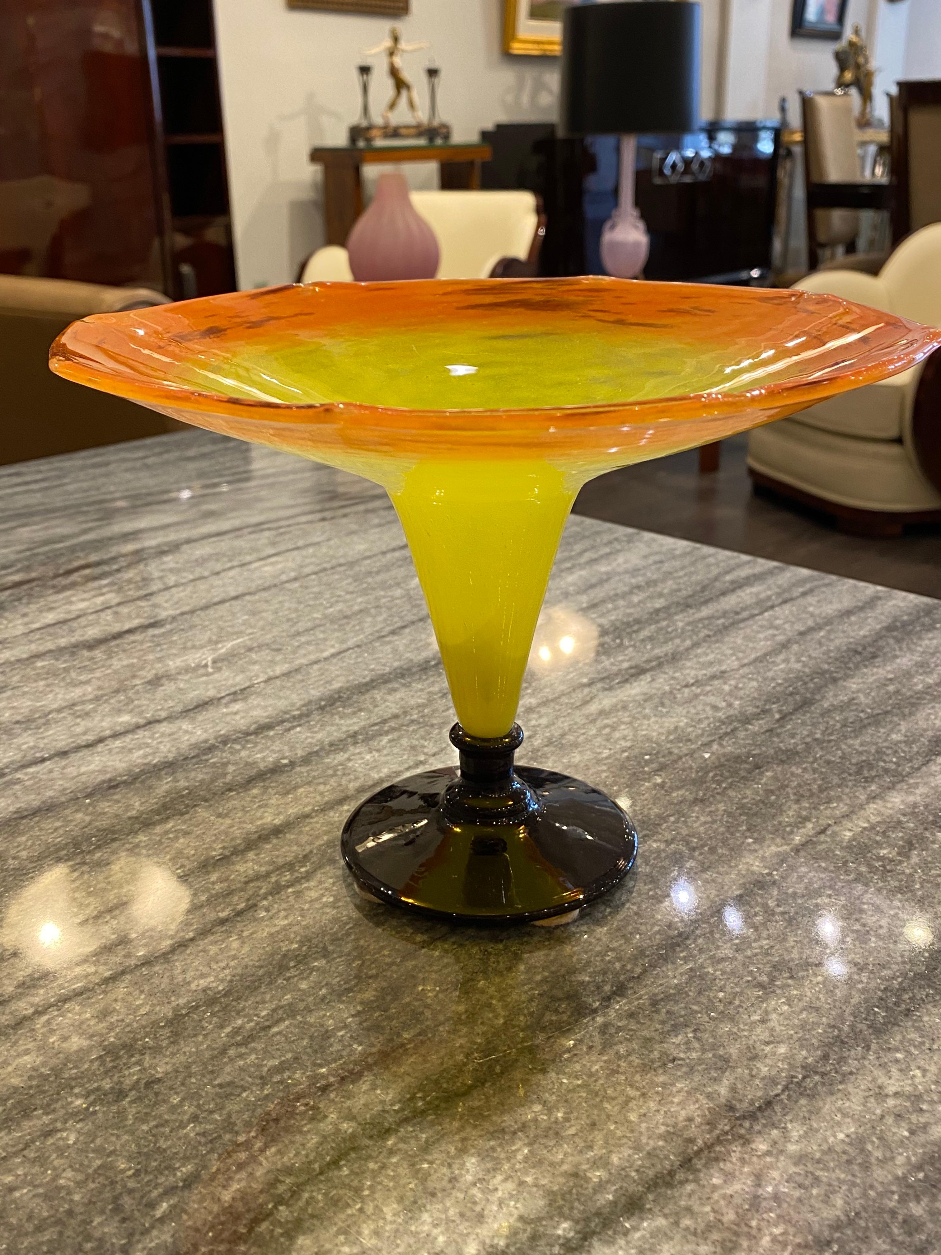 Art Deco glass tazza by Charles Schneider, in orange and bright yellow colors with a deep purple foot.
Made in France,
circa 1928
Signature: 