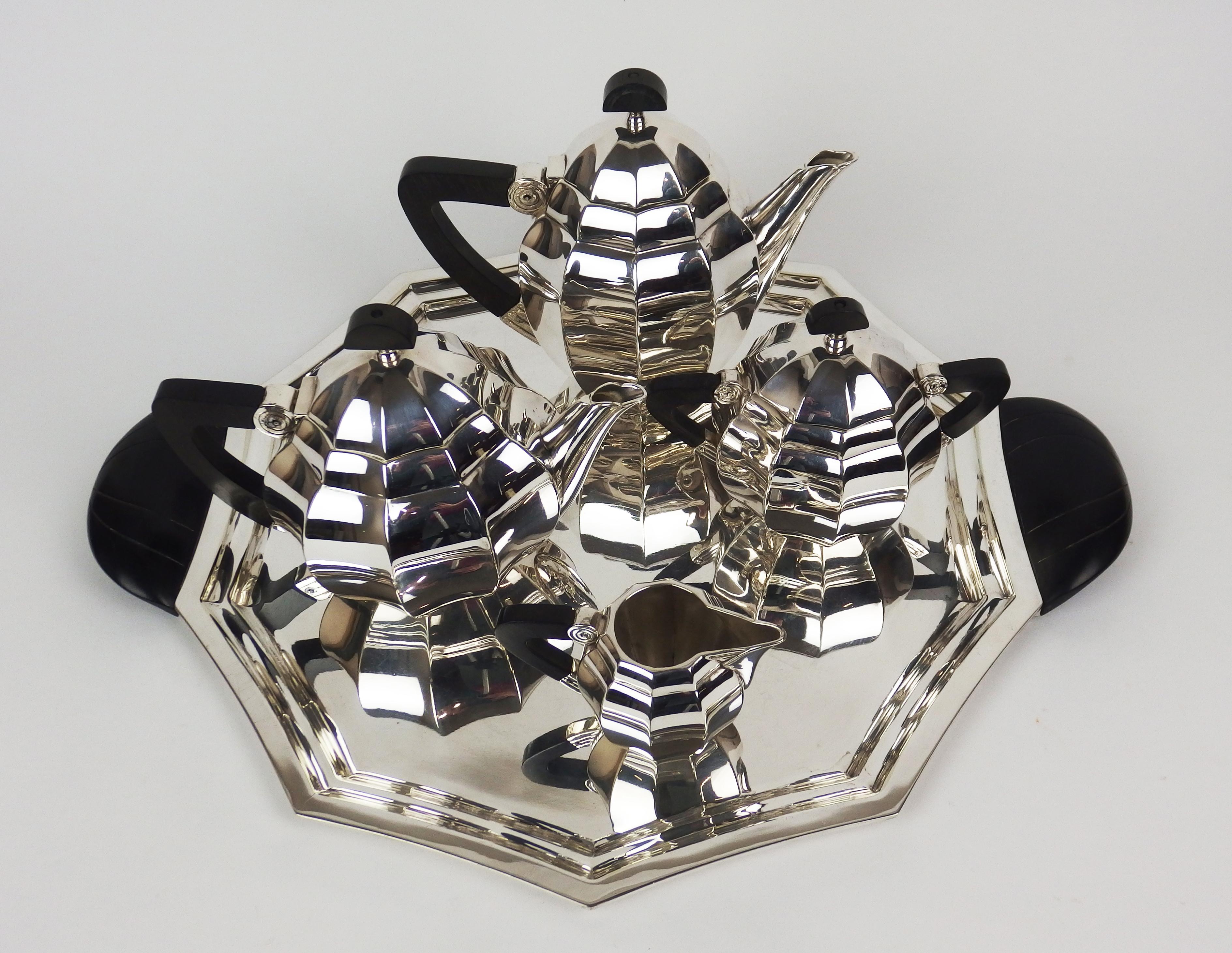 An Art Deco tea-coffee service in silvered metal including a coffee pot ,a tea pot,a milk pot ,a sugar dish and a tray in silvered metal. The handles are in black bakelite. Designed by Maurice Dufrene for Gallia Christofle.
Dimensions:
-coffee