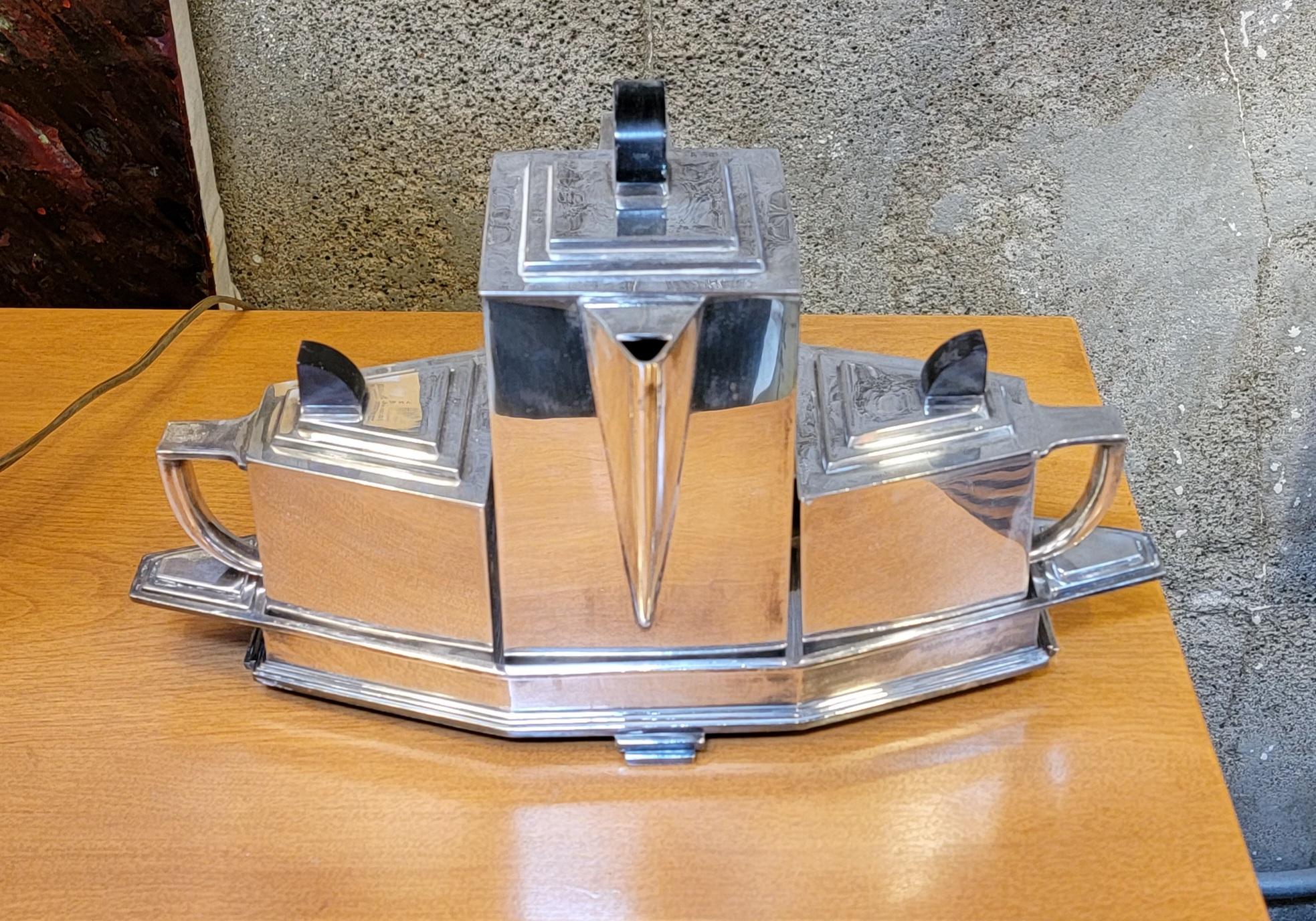 Classic, period 4 piece Art Deco tea service. Tea pot, cream, sugar and tray. Silver plated nickel by International Silver Plate Company. Also marked 