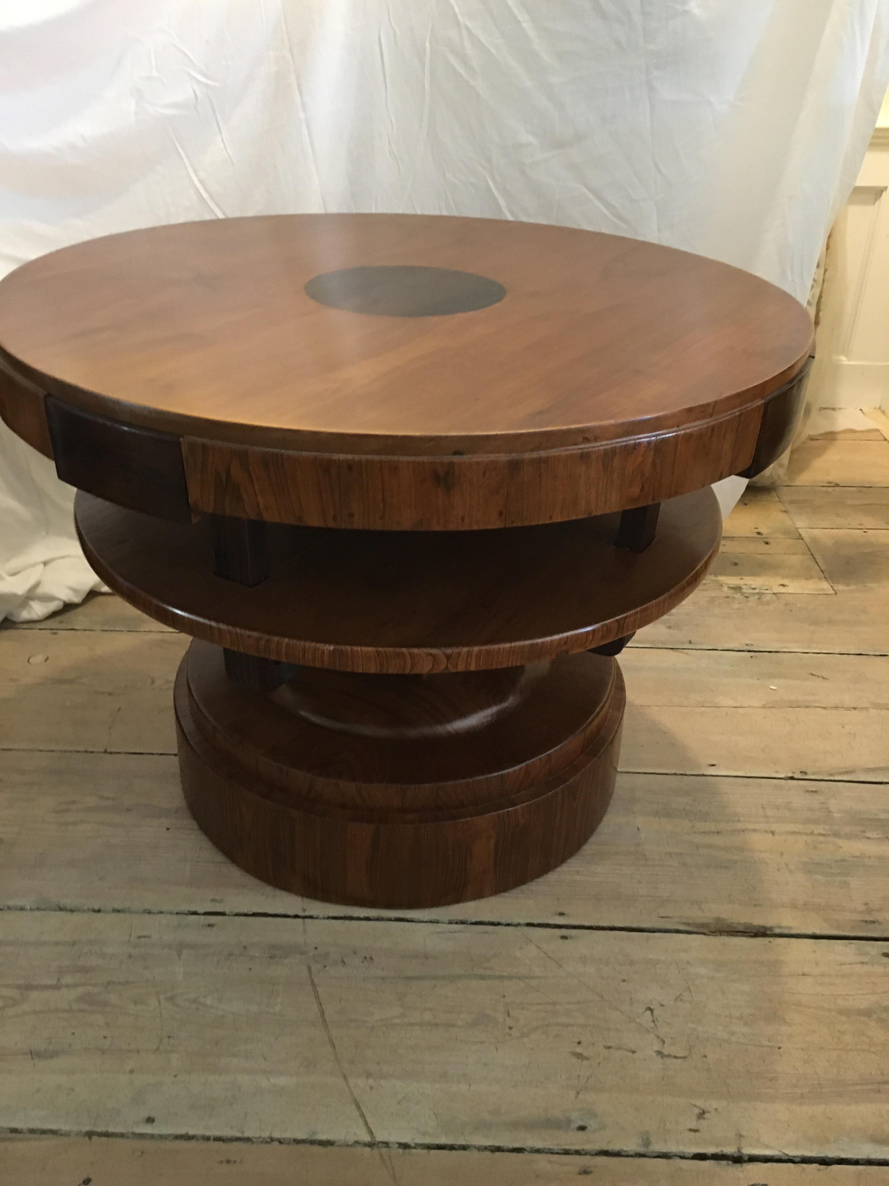 A beautiful and robust teak swivel center or dining table (I have a 47