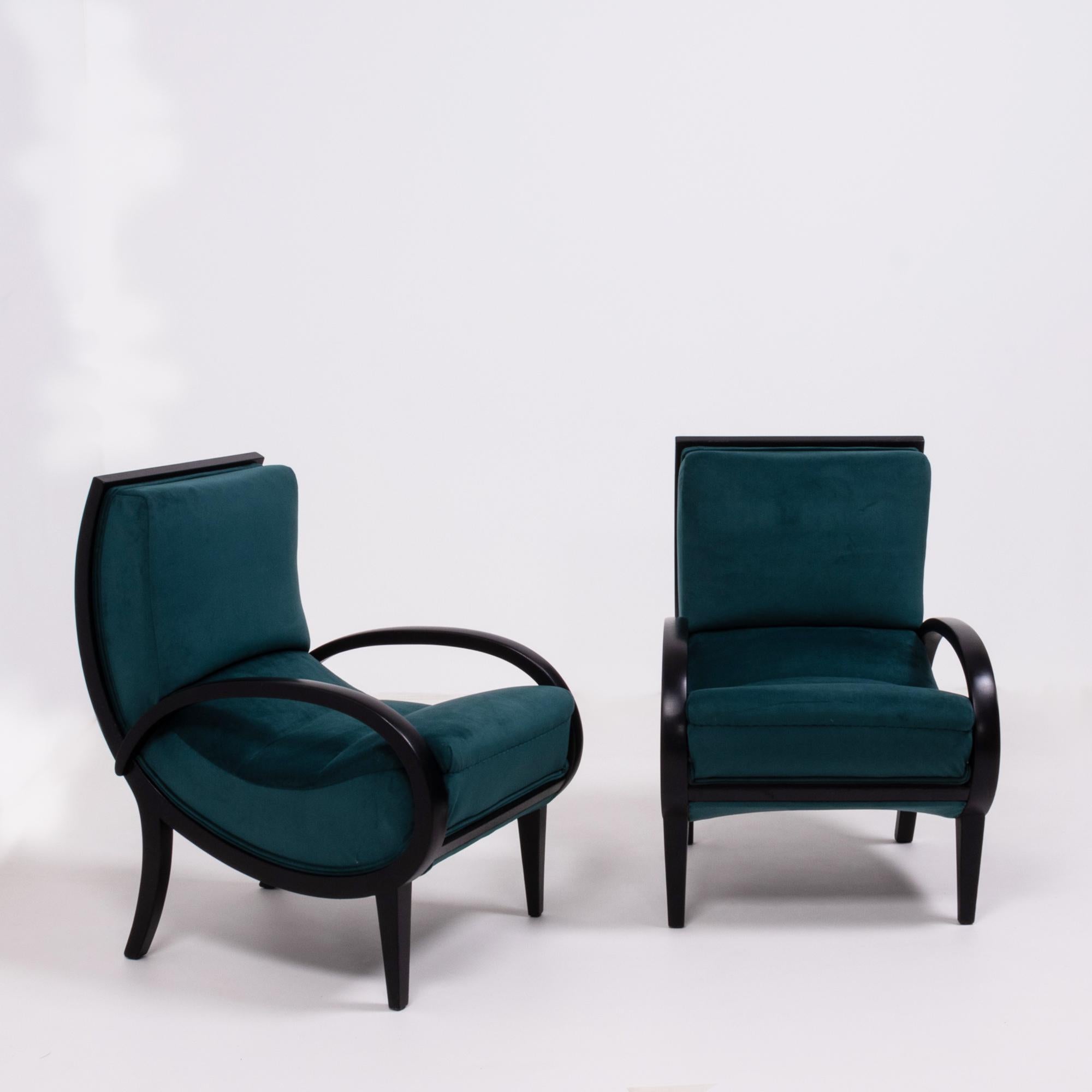This pair of original Art Deco armchairs designed in the style of Jindrich Halabala have been completely restored and newly and fully reupholstered in sumptuous teal velvet.

The frame and arms are constructed from dark bentwood, creating smooth,