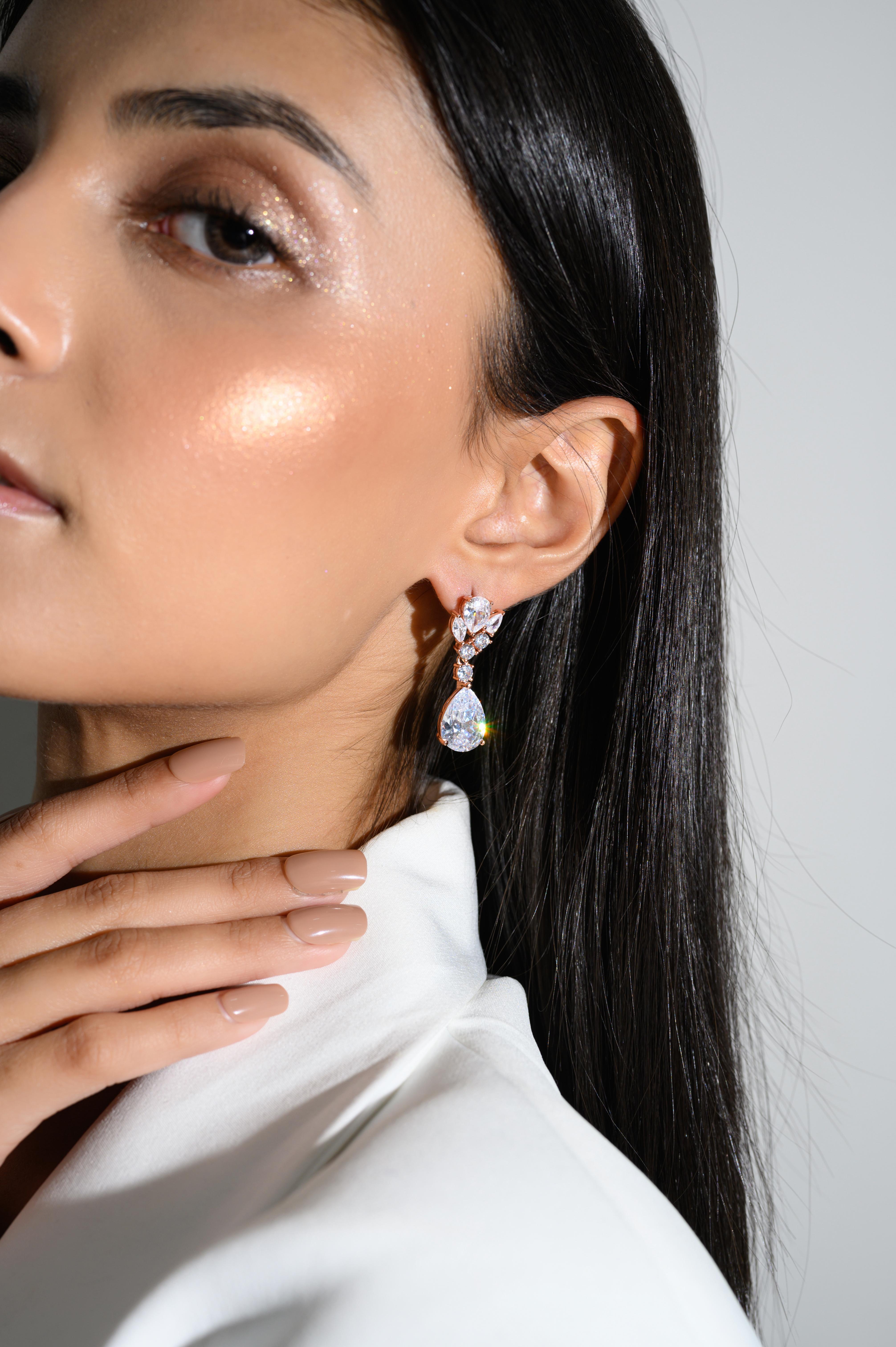Teardrop Leaf Cubic Zirconia Wedding Rose Gold Plated Earrings in sterling silver. You shall need these statement drop earrings to make a statement with your look. Each piece features dazzling cubic zirconia stones, renowned for their brilliance and