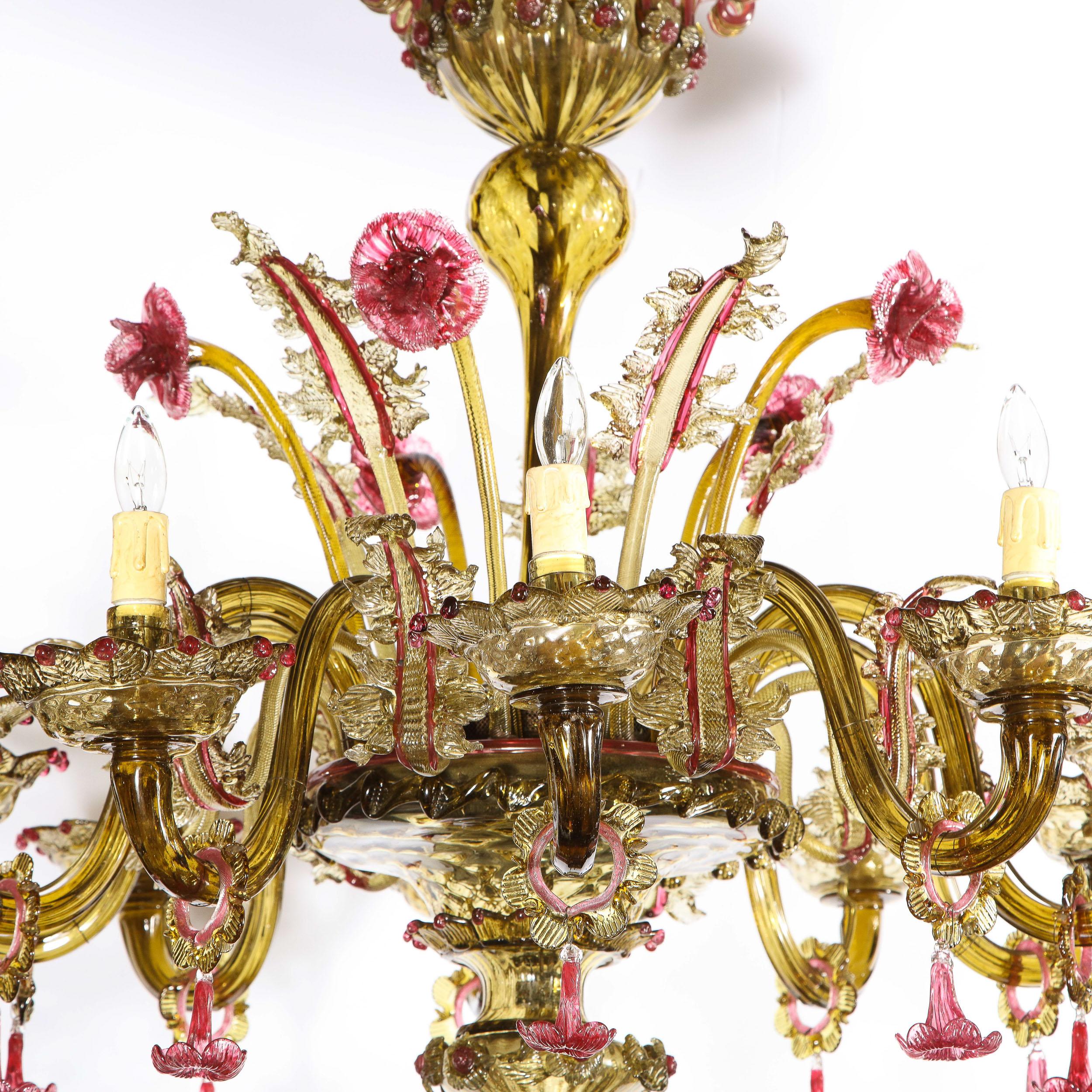 This gorgeous Art Deco chandelier was handblown in Murano, Italy- the island off the coast of Venice renowned for centuries for its superlative glass production- circa 1940. The chandelier features ten undulating sculptural smoked amber Murano arms