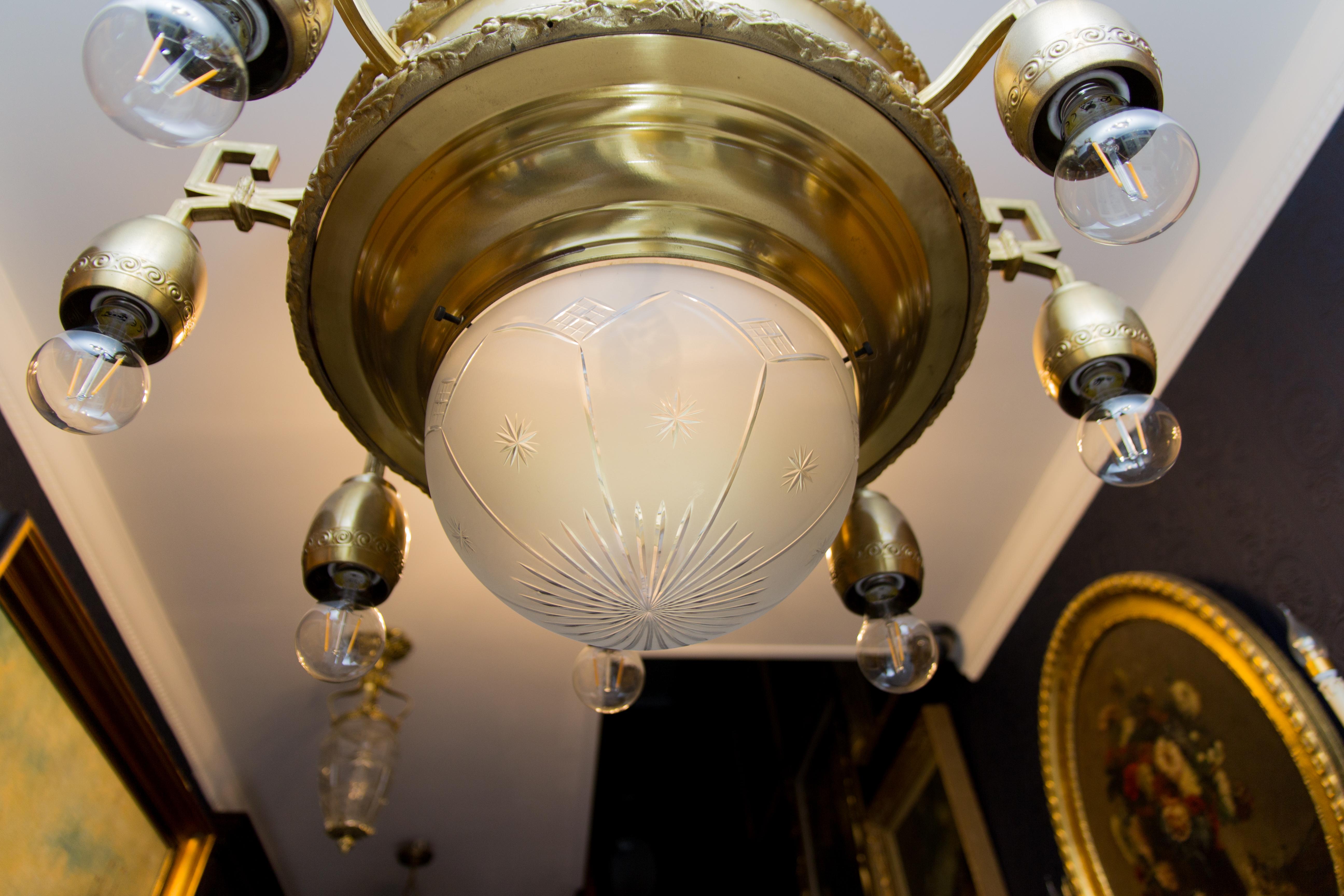 Mid-20th Century Art Deco Ten-Light Brass and Frosted Cut Glass Chandelier